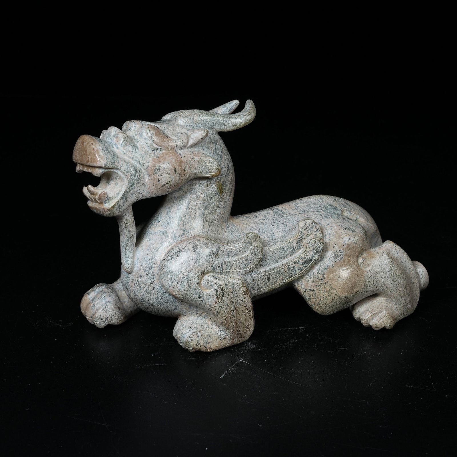 A ARCHAIC JADE AUSPICIOUS BEAST ORNAMENT: Archaic Jade Auspicious Beast Ornament