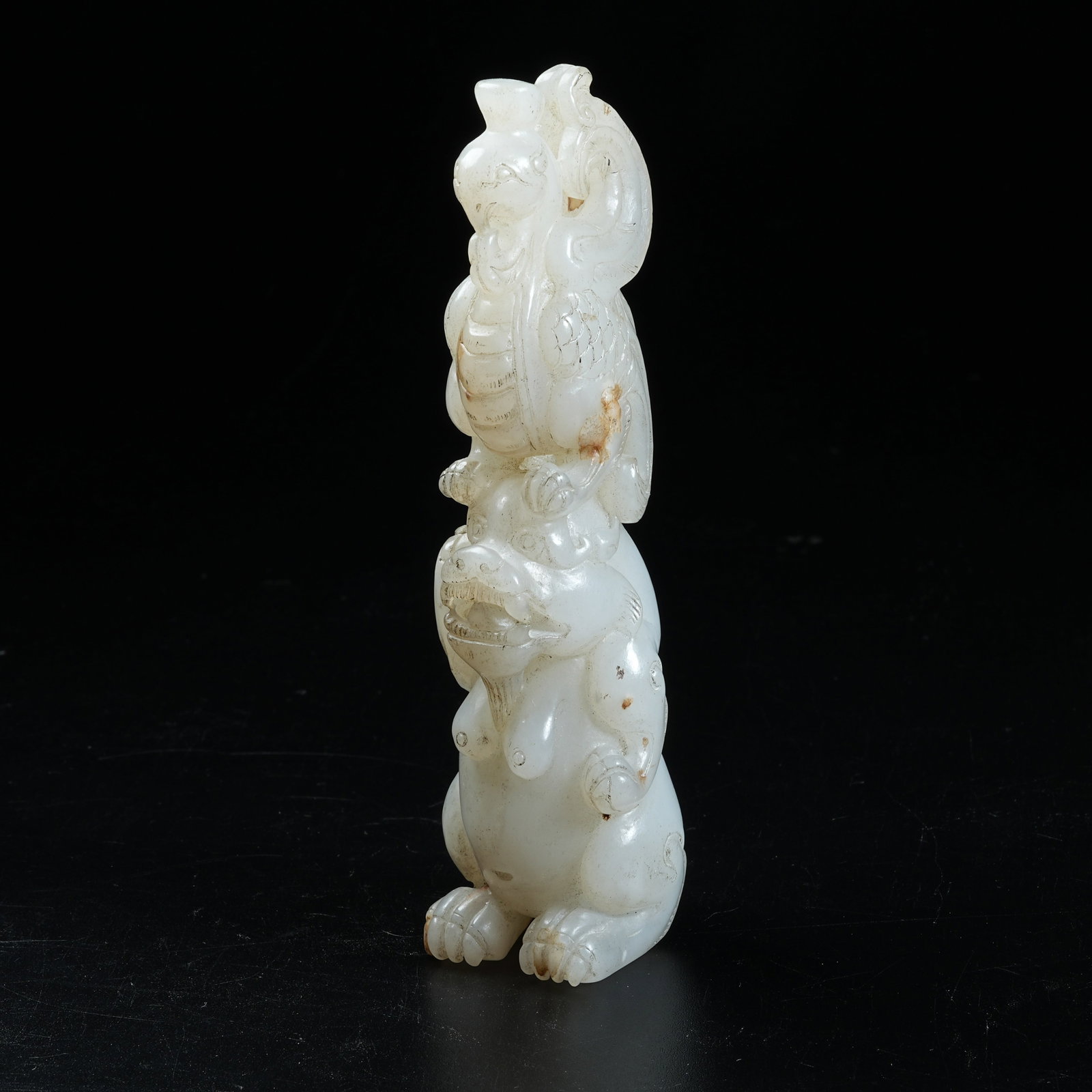 A ANCIENT JADE ORNAMENT OF DIVINE BEAST BEARING PHOENIX: Ancient Jade Ornament of Divine Beast Bearing Phoenix