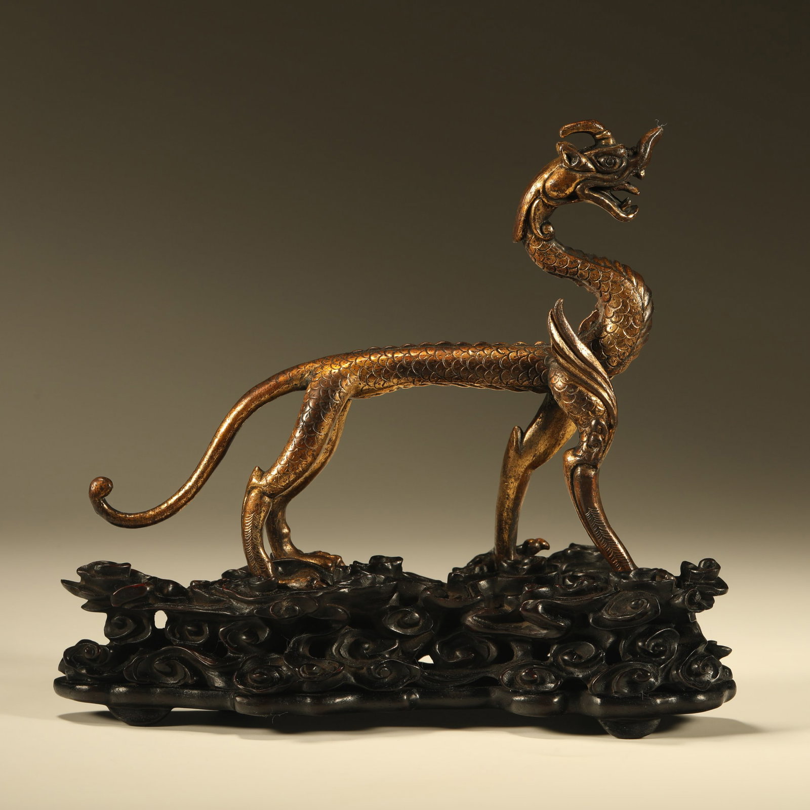A GILT BRONZE DRAGON ORNAMENT: Gilt Bronze Dragon Ornament