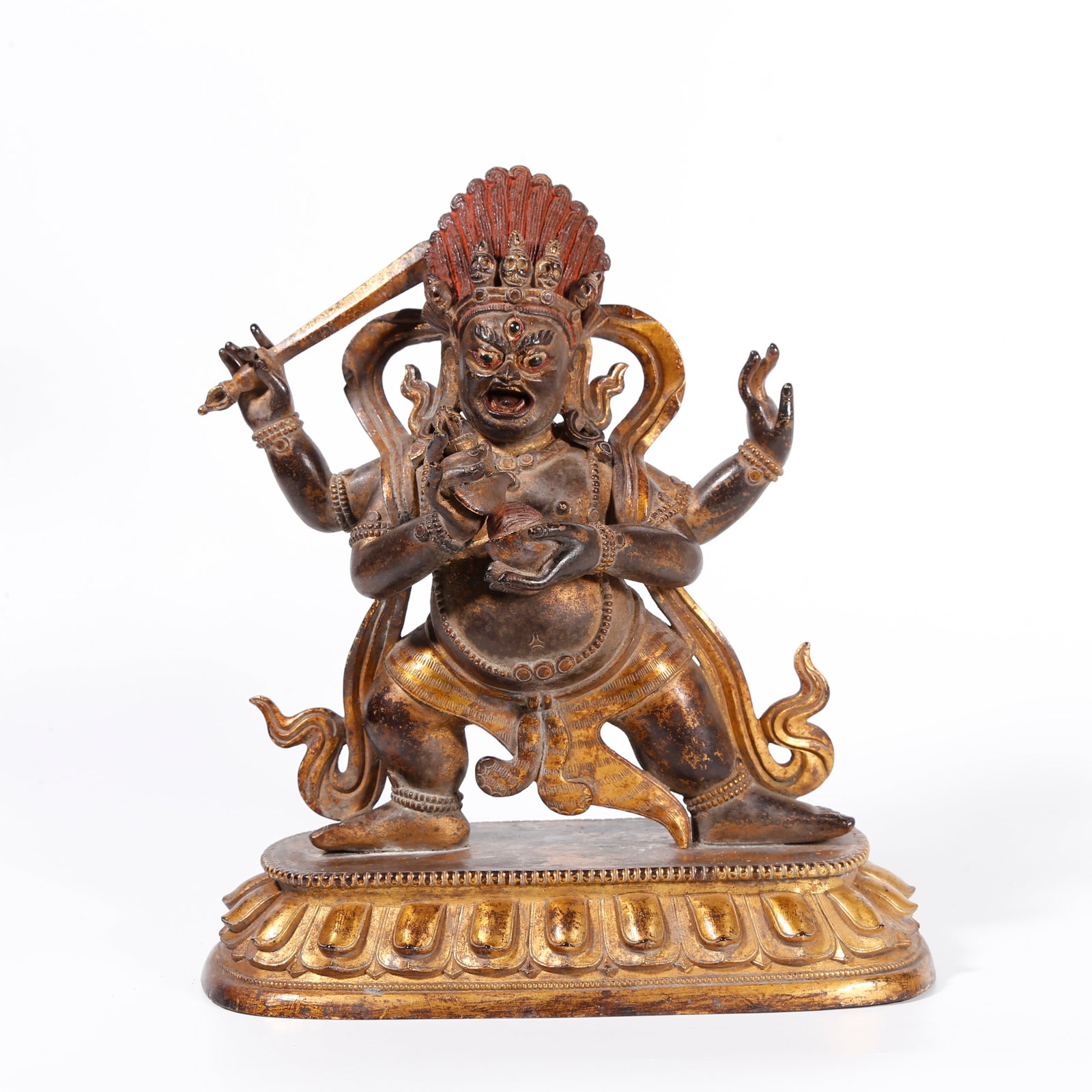 A GILT BRONZE STATUE OF FOUR-ARMED MAHAKALA (1 of 9)
