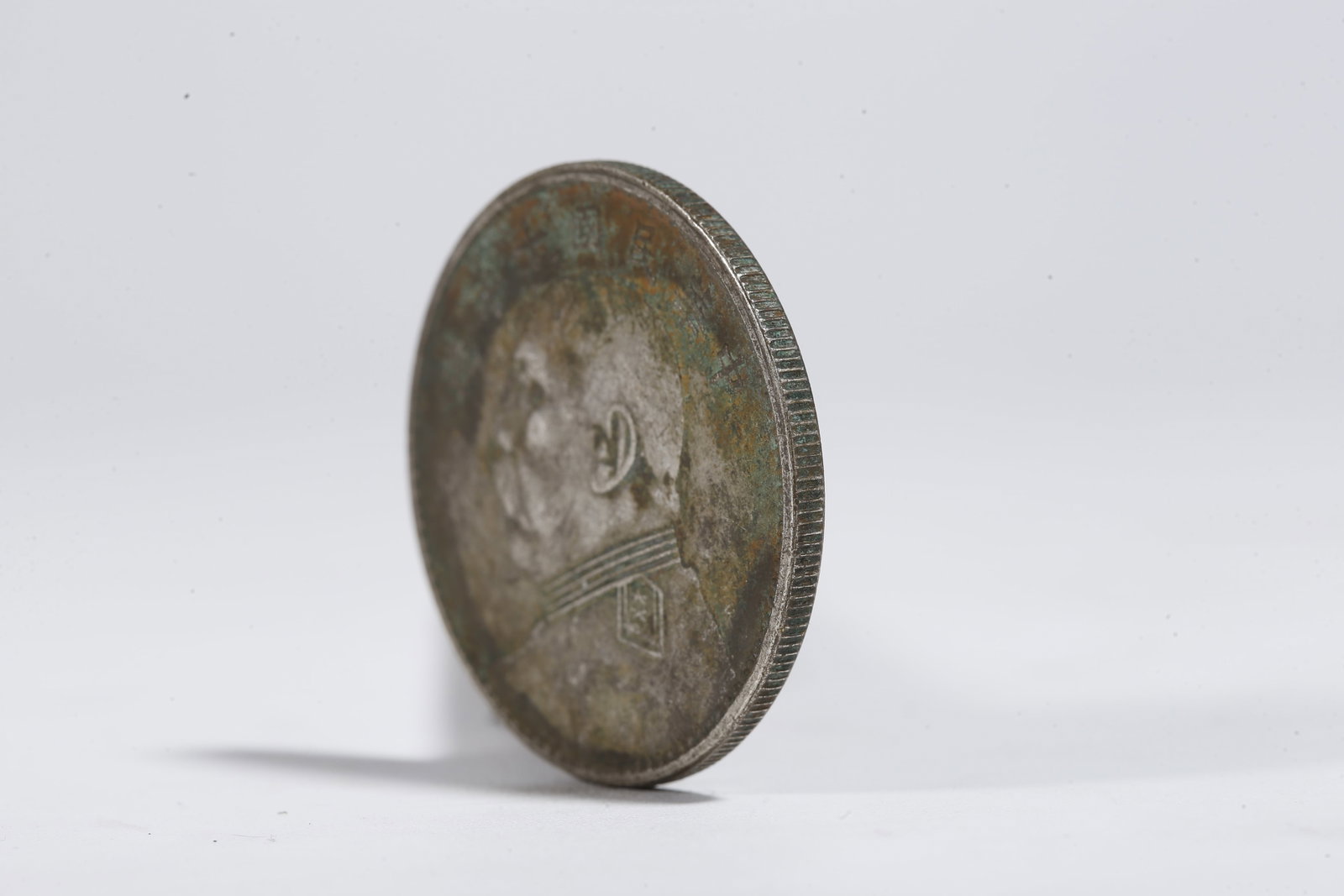 A SILVER DOLLAR COIN - 2