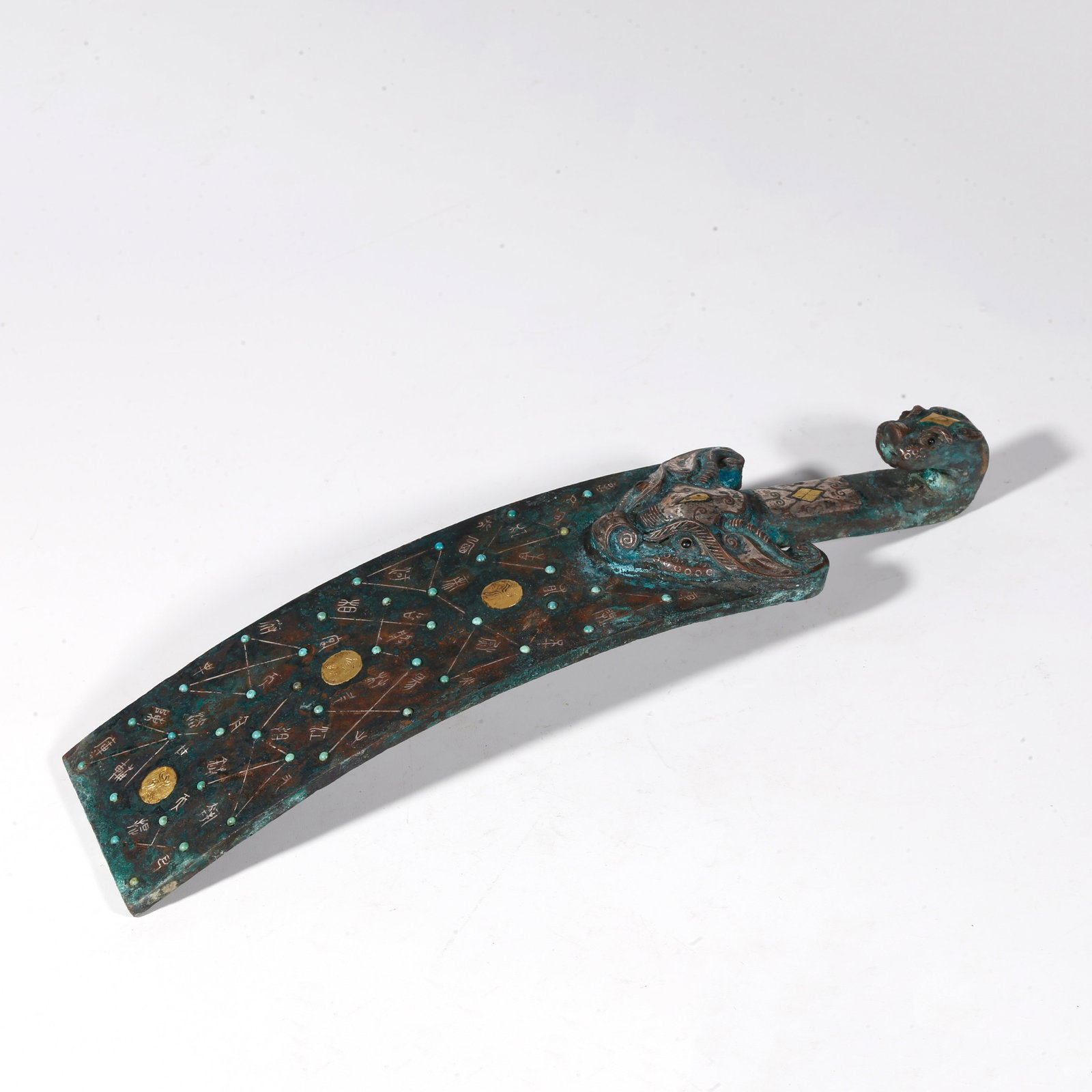 A BRONZE DRAGON-SHAPED BELT HOOK INLAID WITH GOLD AND SILVER: Bronze Dragon-shaped Belt Hook Inlaid with Gold and Silver