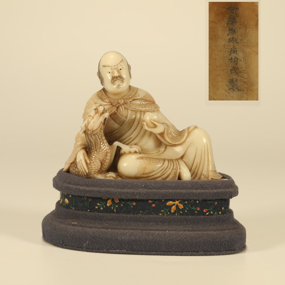 A LOTUS ROOT STONE CARVING OF SUBDUING DRAGON ARHAT: Lotus Root Stone Carving of Subduing Dragon Arhat