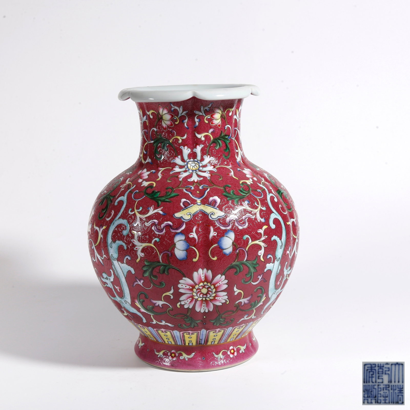 A CRIMSON RED GROUND INTERLOCKING DRAGON PATTERN FLORAL RIM ZUN: Crimson Red Ground Interlocking Dragon Pattern Floral Rim Zun