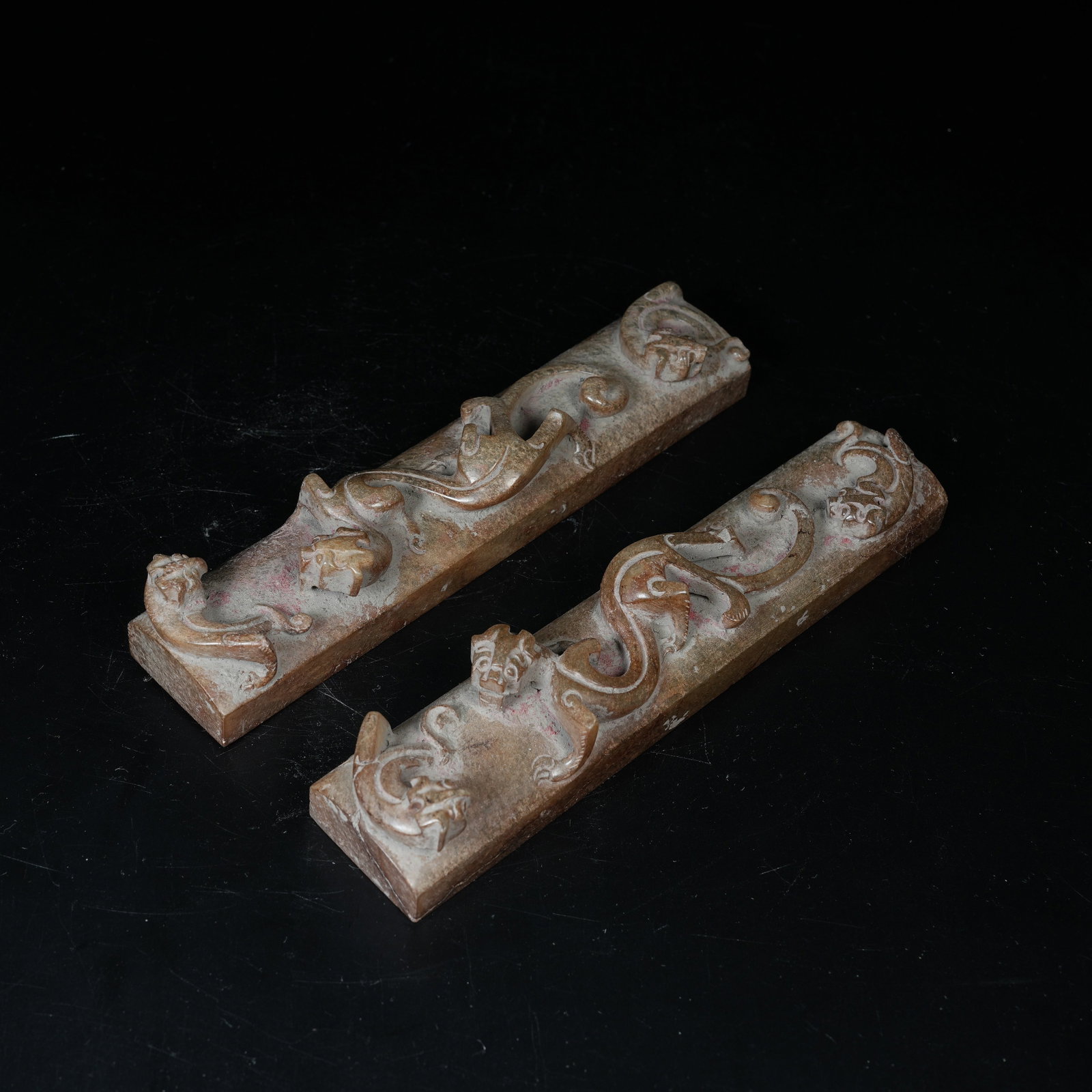 A SET OF ARCHAIC JADE PAPERWEIGHTS CARVED WITH CHILONG PATTERNS (1 of 8)