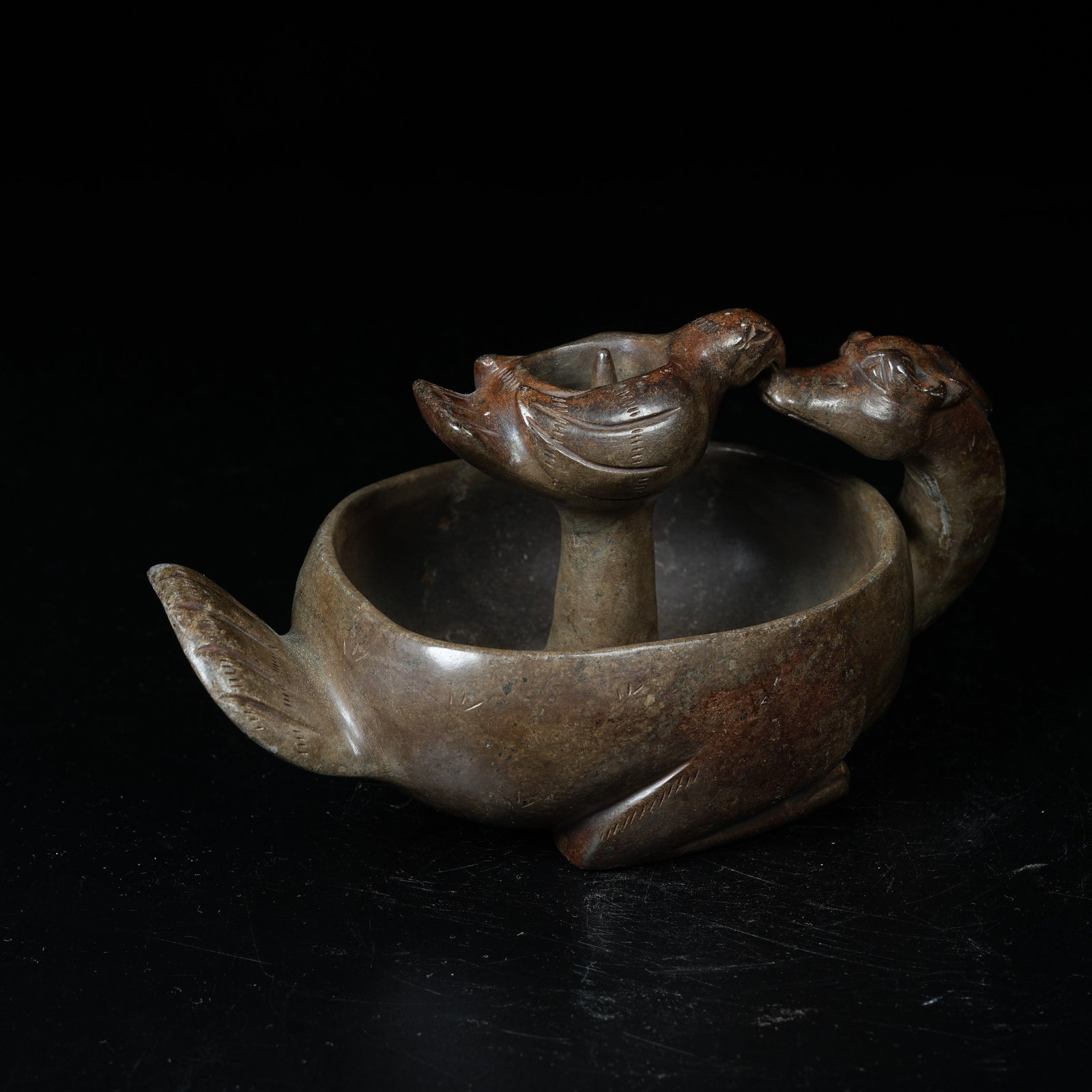 A ARCHAIC JADE CANDLESTICK WITH DIVINE PHOENIX MOTIFS (1 of 9)