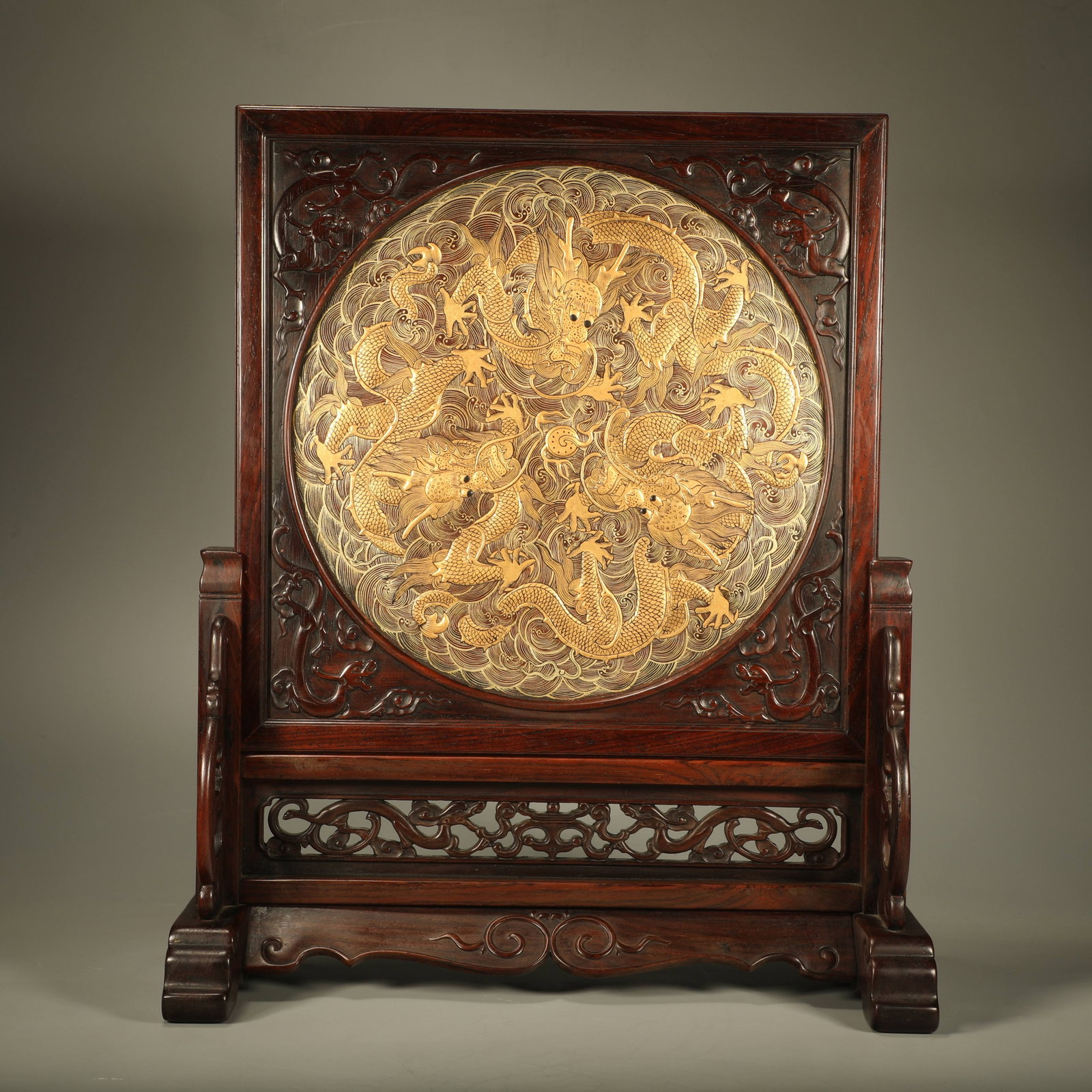A HUANGHUALI WOOD SCREEN WITH GILDED DRAGON MOTIFS (1 of 7)