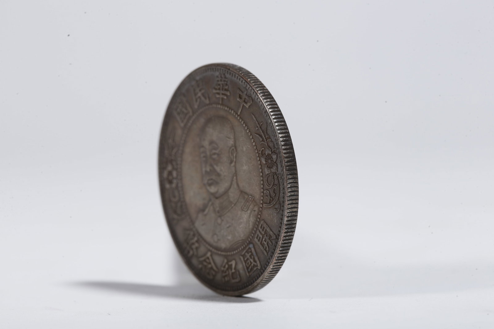 A SILVER DOLLAR COIN - 2