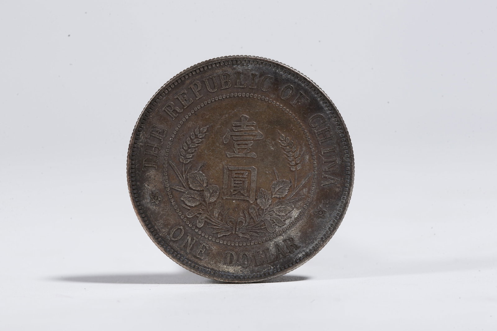A SILVER DOLLAR COIN - 3