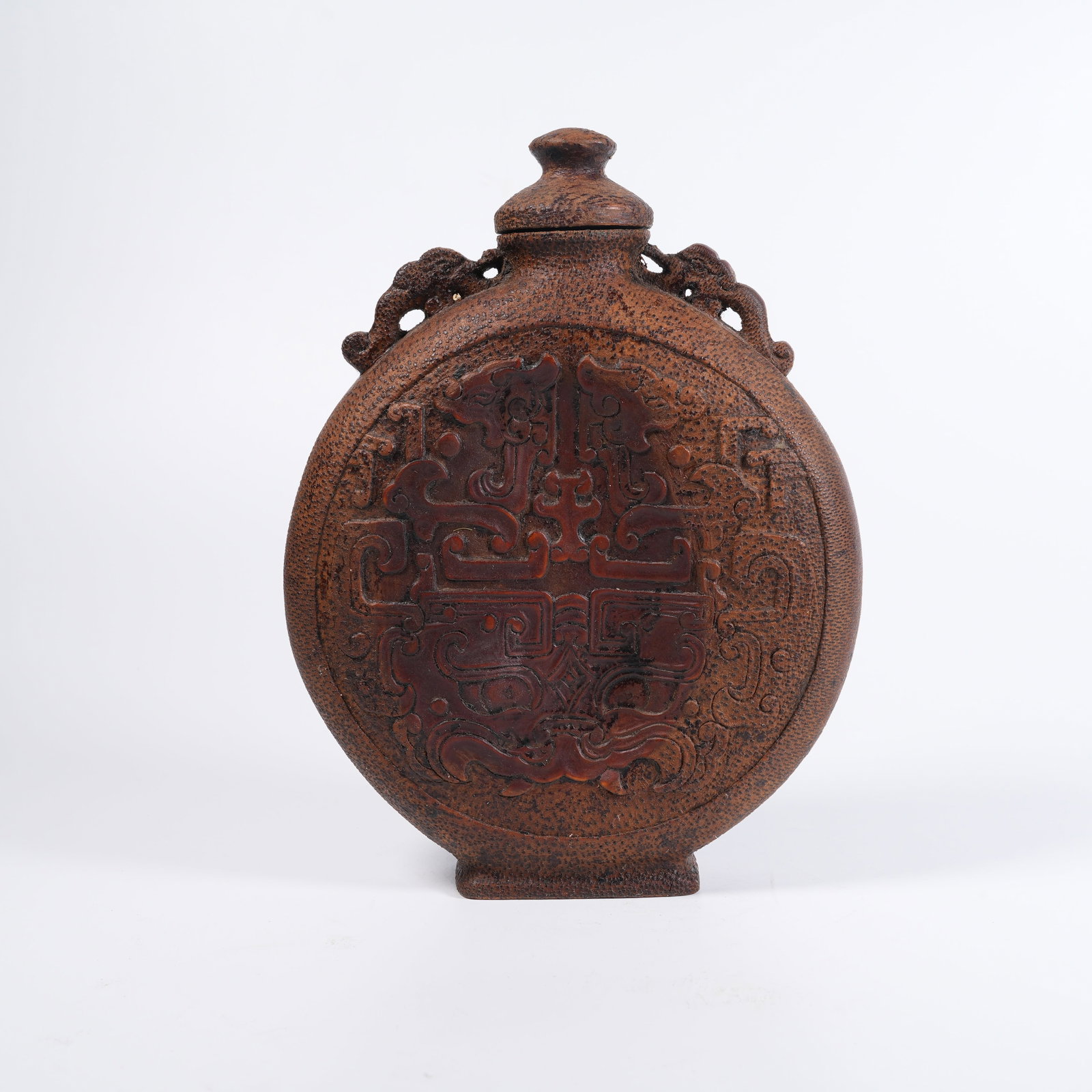 A BAMBOO-ROOT CARVED MOON-SHAPED VASE WITH BEAST-MASK PATTERN: Bamboo-root carved moon-shaped vase with beast-mask pattern