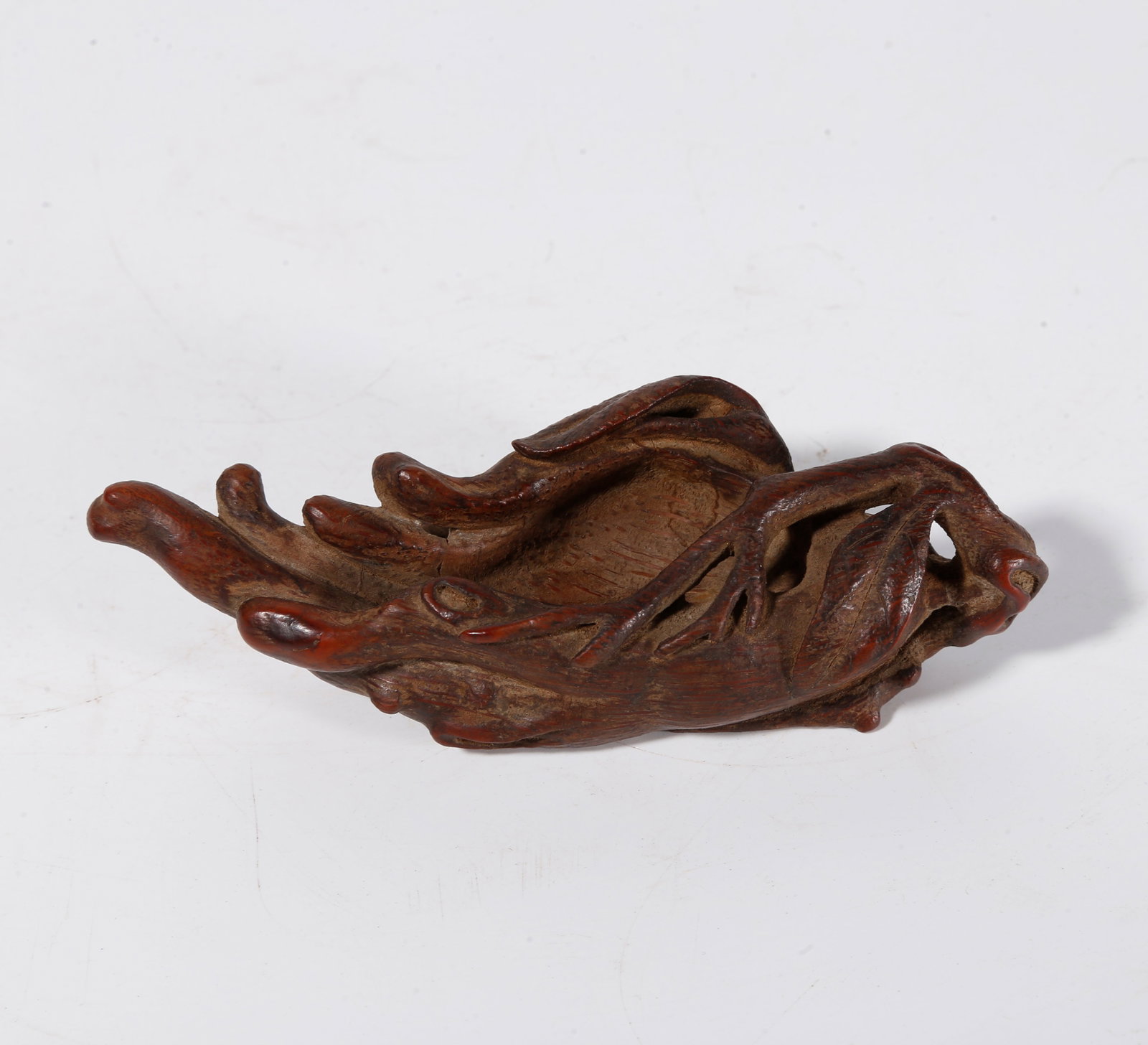 A BRUSH REST CARVED FROM BAMBOO ROOT: Brush rest carved from bamboo root