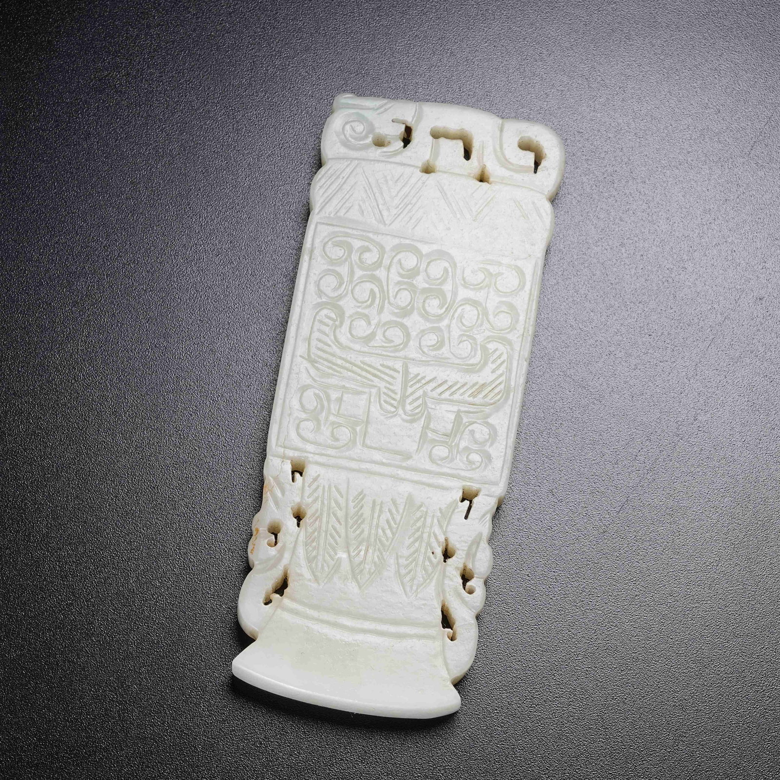 A HETIAN JADE PENDANT WITH BEAST MASK PATTERN: Hetian Jade Pendant with Beast Mask Pattern