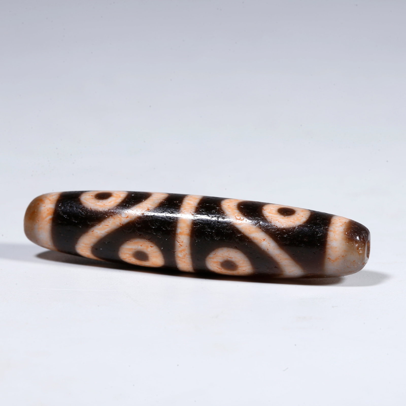 A EIGHT-EYED DZI BEAD (1 of 9)