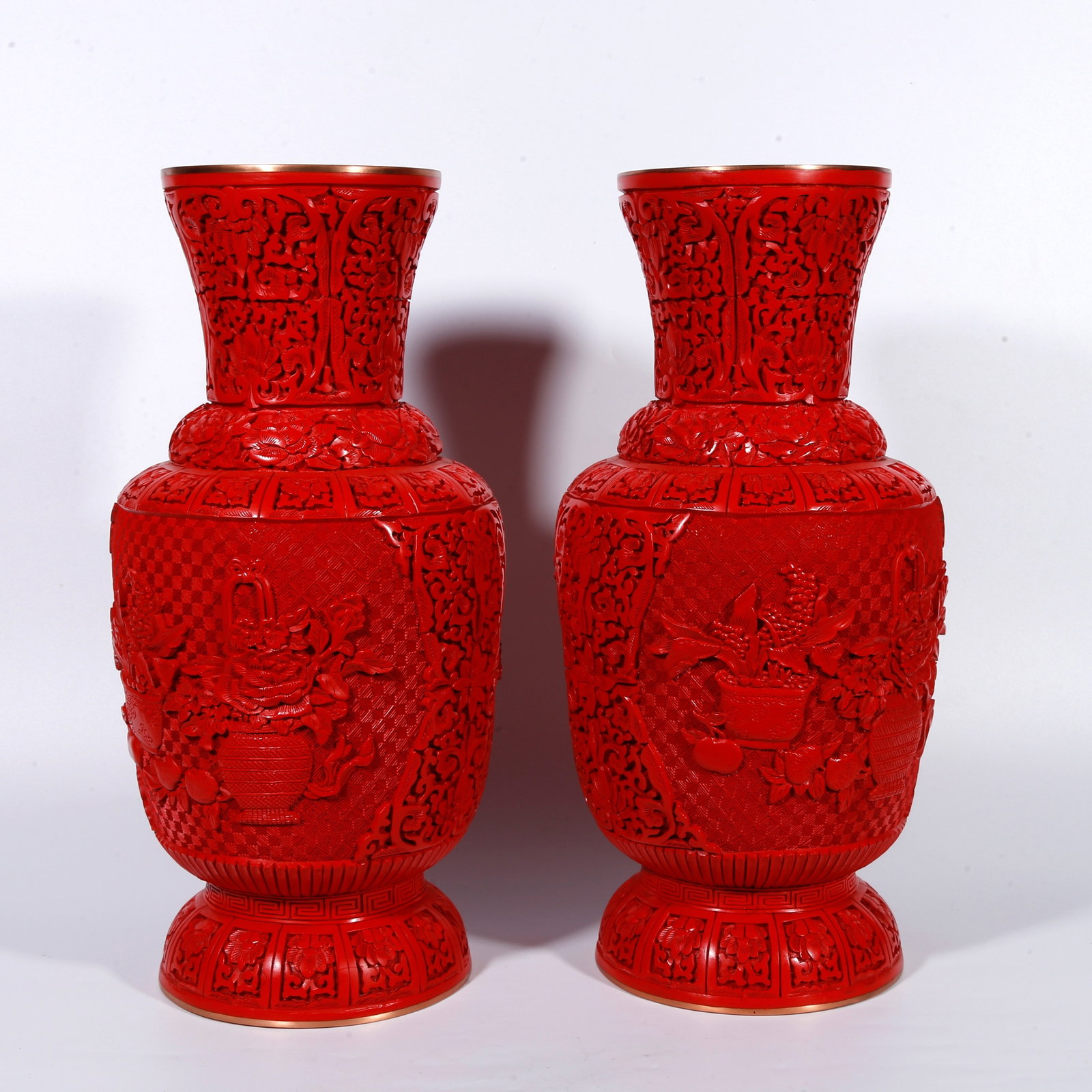 A BRONZE-BODY CARVED-RED APPRECIATION VASE WITH FLOWER-BASKET PATTERN (PAIR): Bronze-body carved-red appreciation vase with flower-basket pattern (pair)