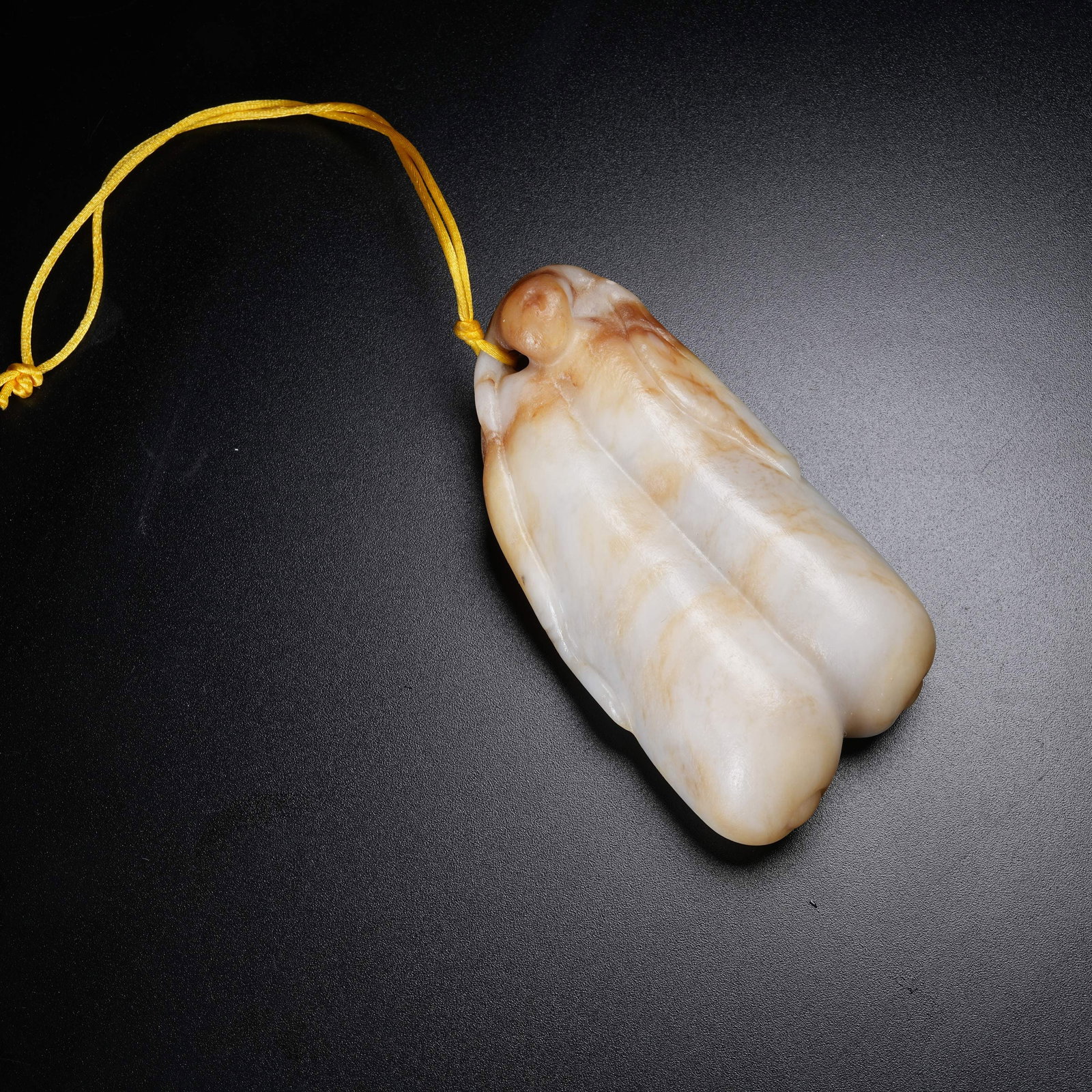 A HETIAN JADE FRUIT AND MELON PENDANT: Hetian Jade Fruit and Melon Pendant