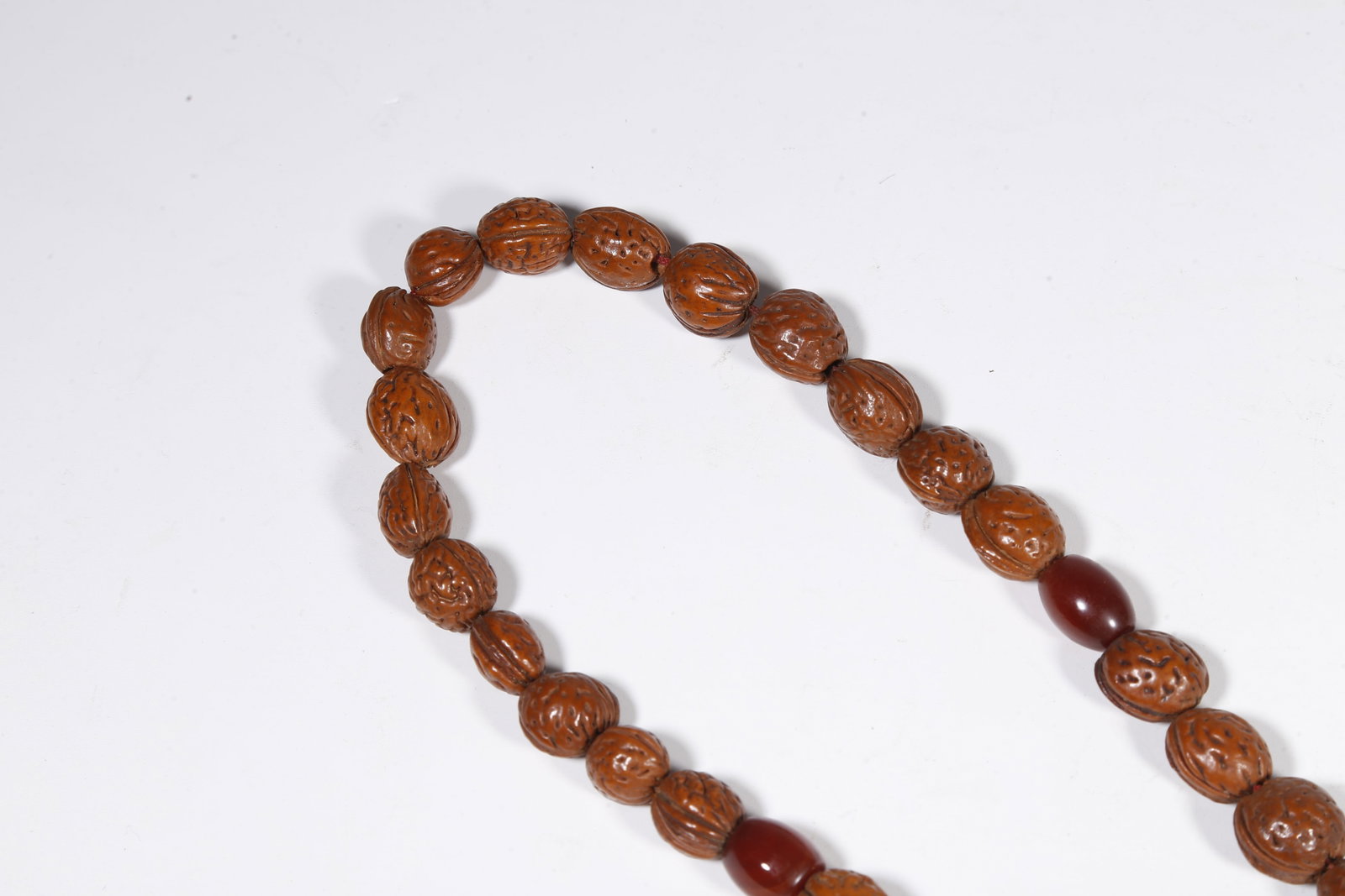 A NUT-KERNEL PENDANT - 4