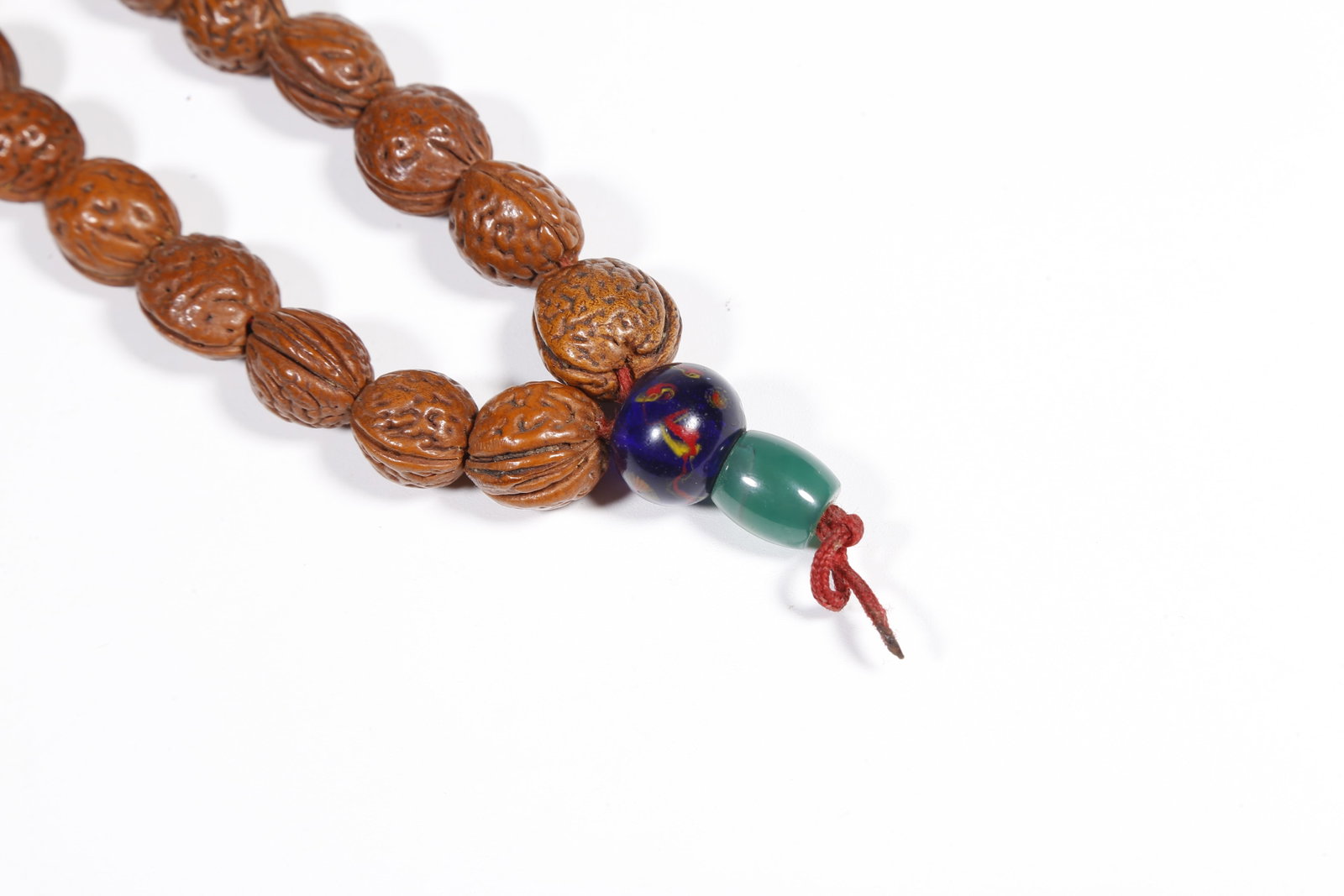 A NUT-KERNEL PENDANT - 7