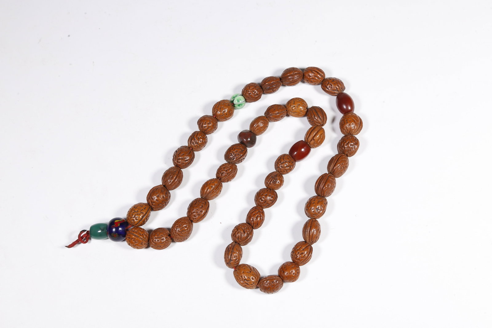 A NUT-KERNEL PENDANT - 9