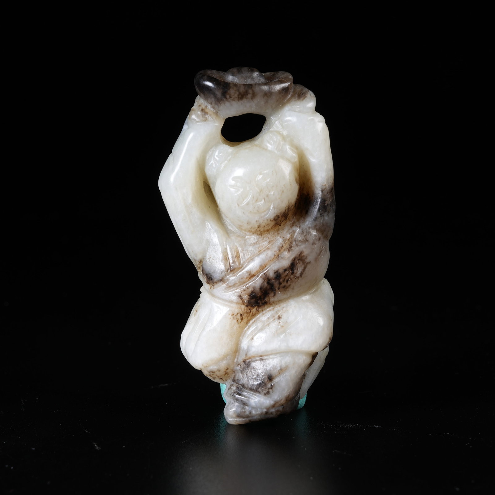 A HETIAN JADE HANGING ORNAMENT OF BOY DELIVERING TREASURES: Hetian Jade Hanging Ornament of Boy Delivering Treasures