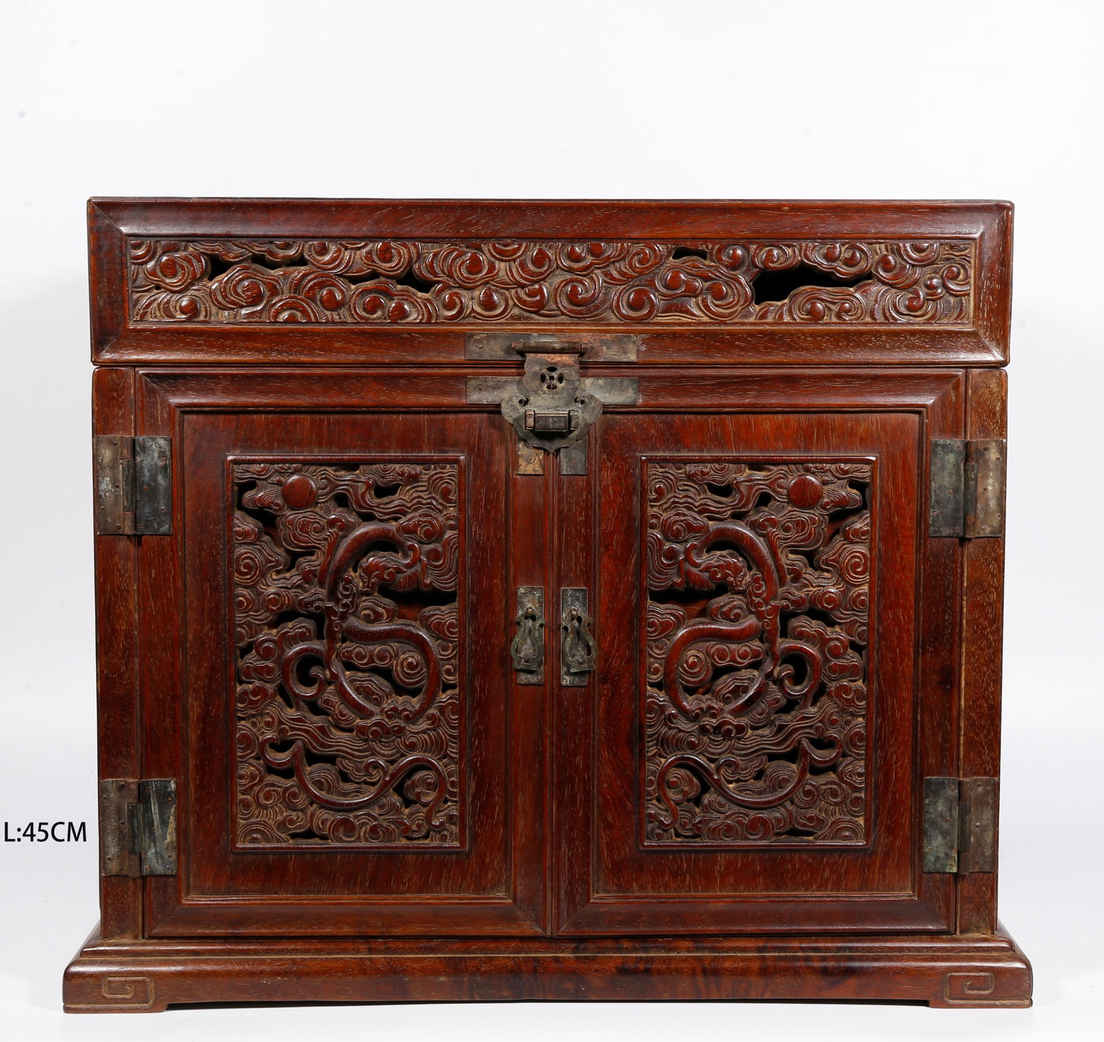A OPENWORK DRAGON-PATTERN OFFICIAL LEATHER CHEST OF HUANGHUALI WOOD: Openwork dragon-pattern official leather chest of huanghuali wood