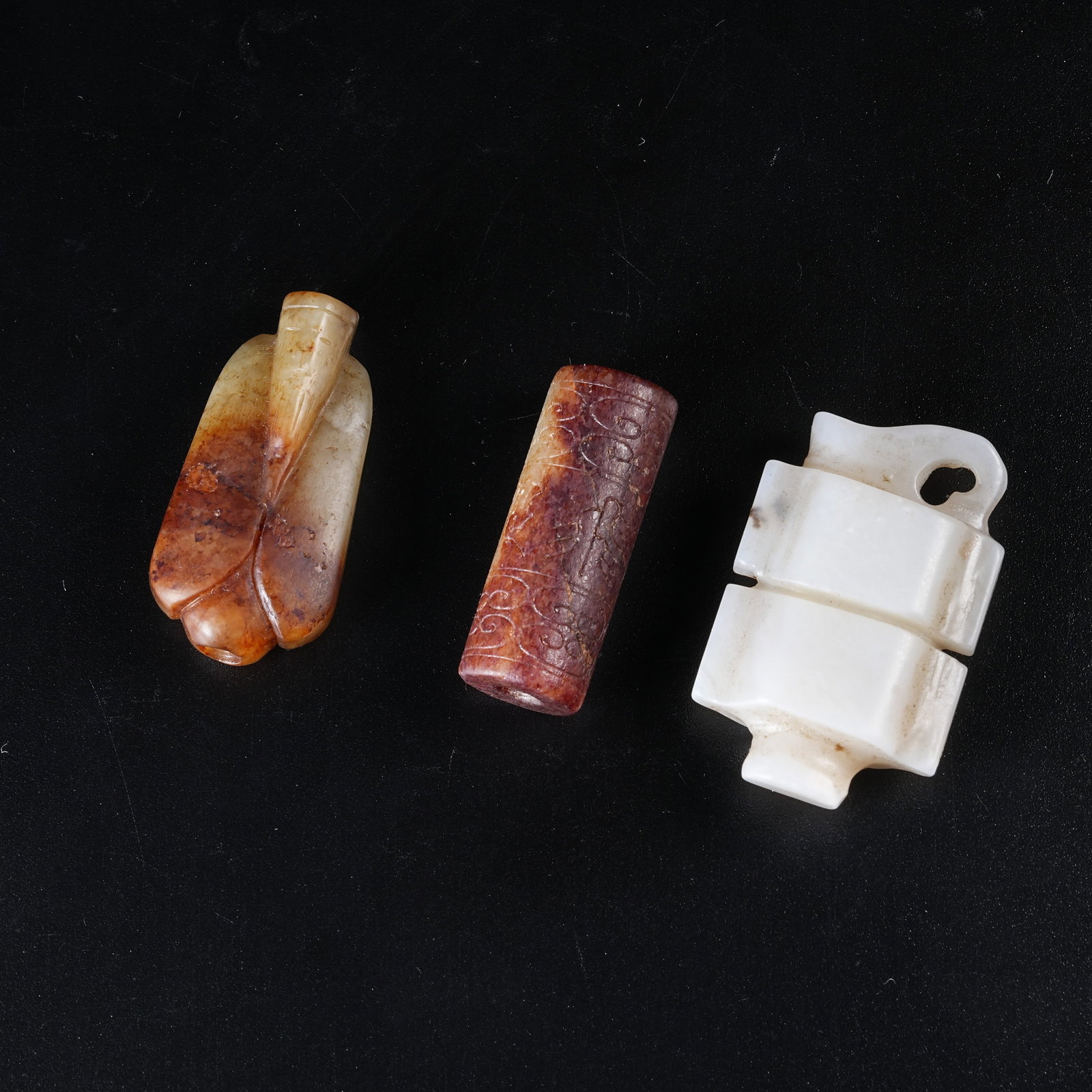 A SET OF ANCIENT JADE PENDANTS (1 of 9)