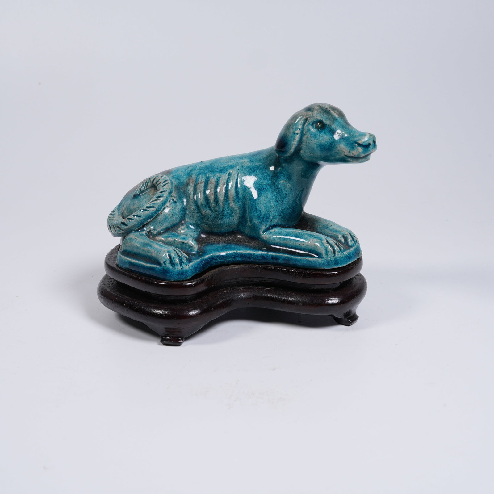 A PEACOCK-BLUE-GLAZE MYTHICAL-BEAST PAPERWEIGHT (1 of 8)