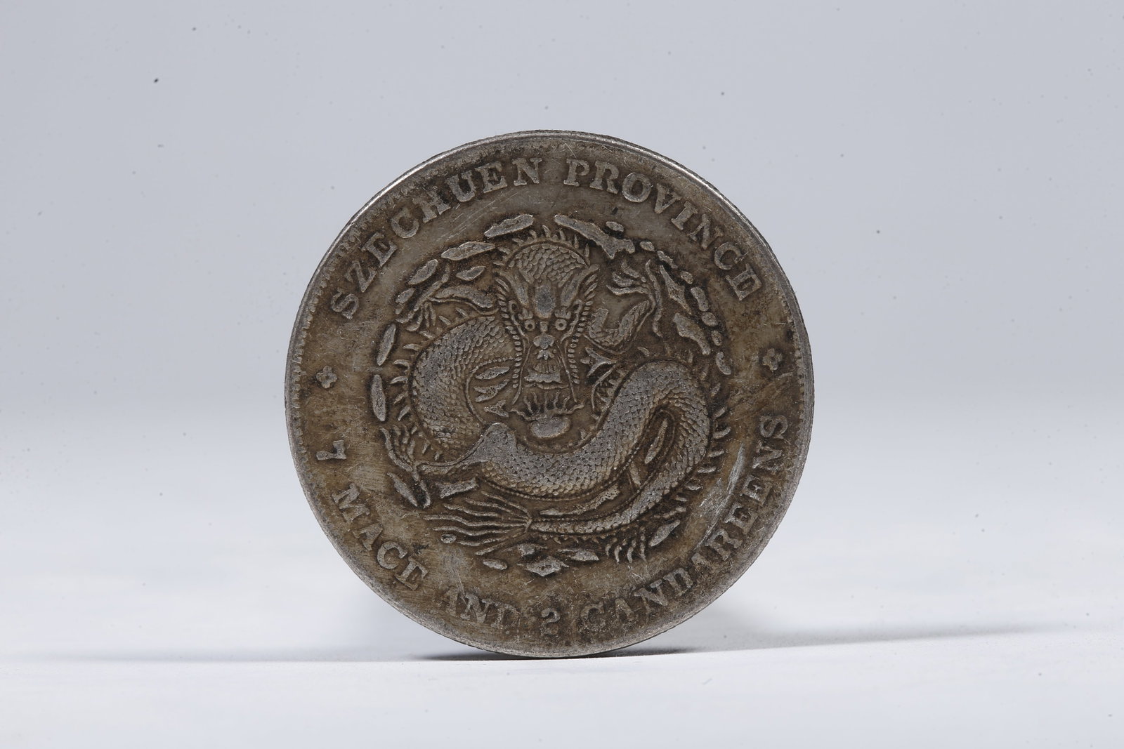 A SILVER DOLLAR COIN - 3