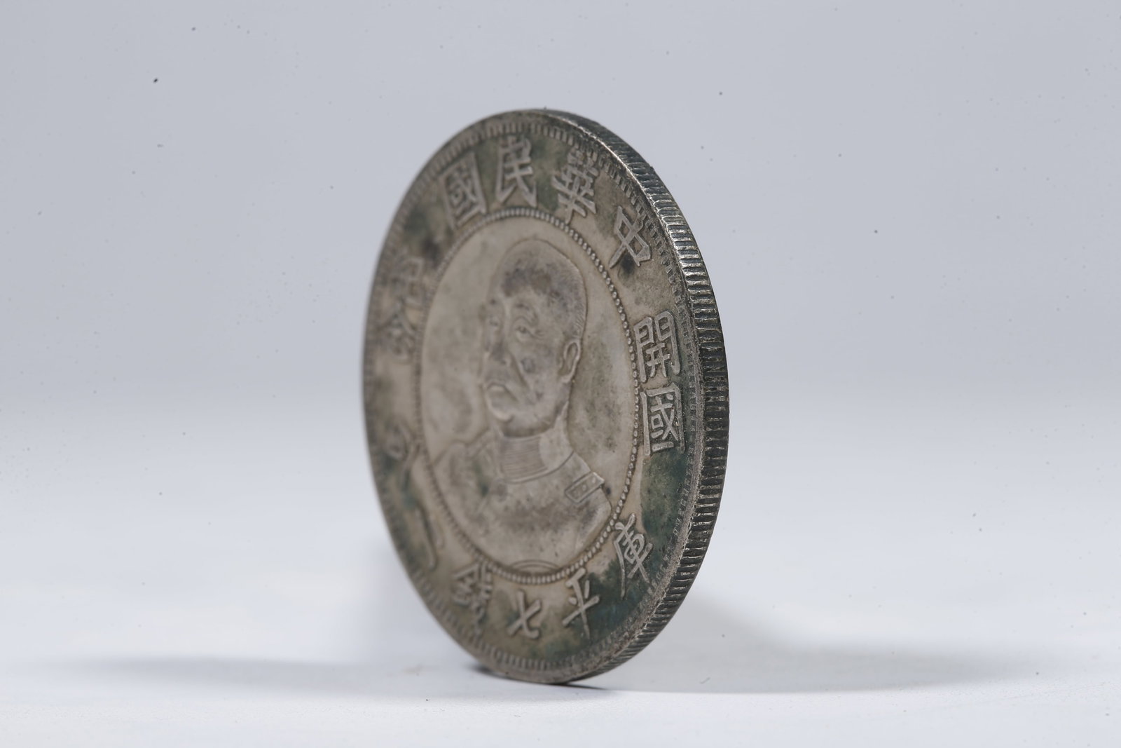 A SILVER DOLLAR COIN - 2