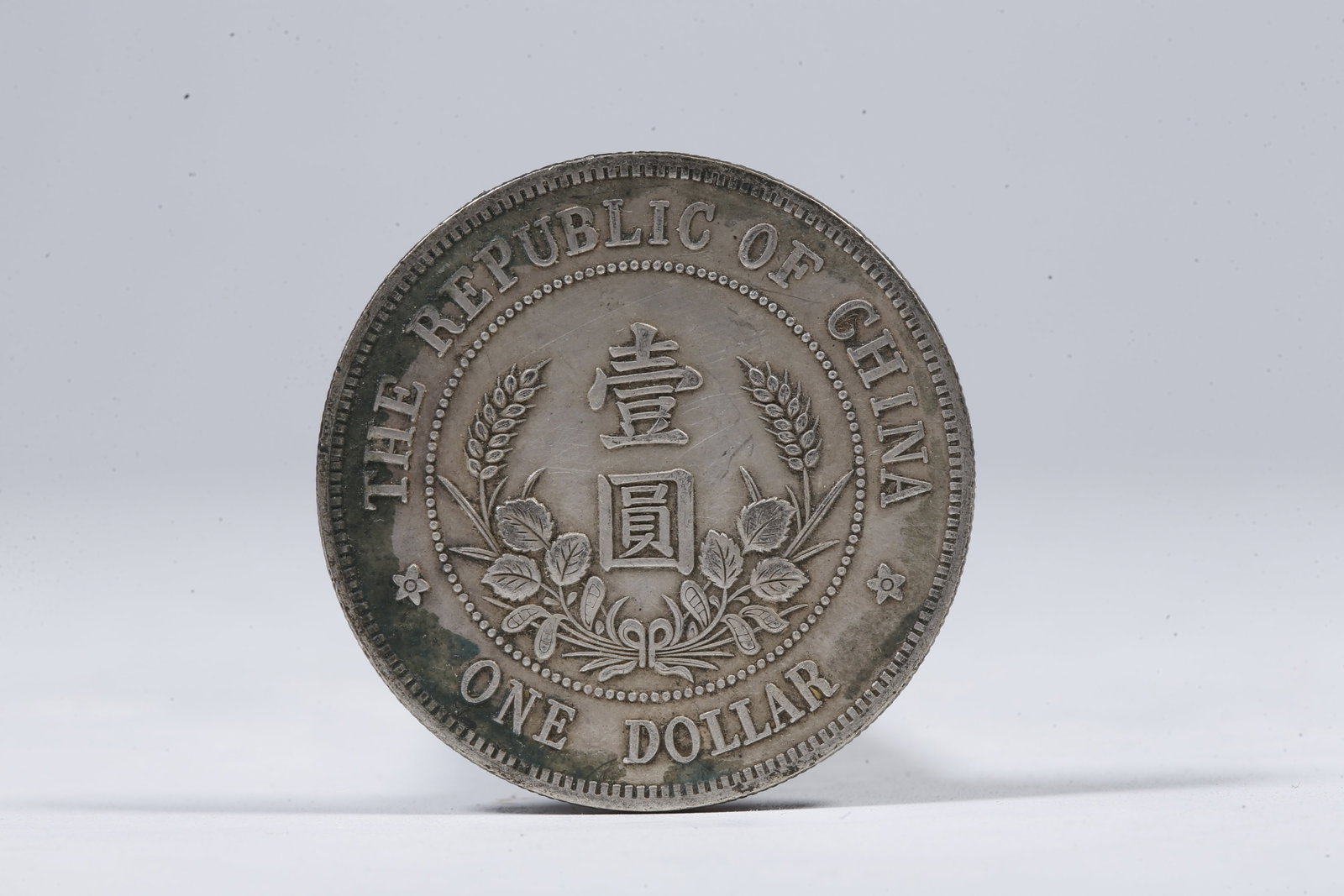 A SILVER DOLLAR COIN - 3