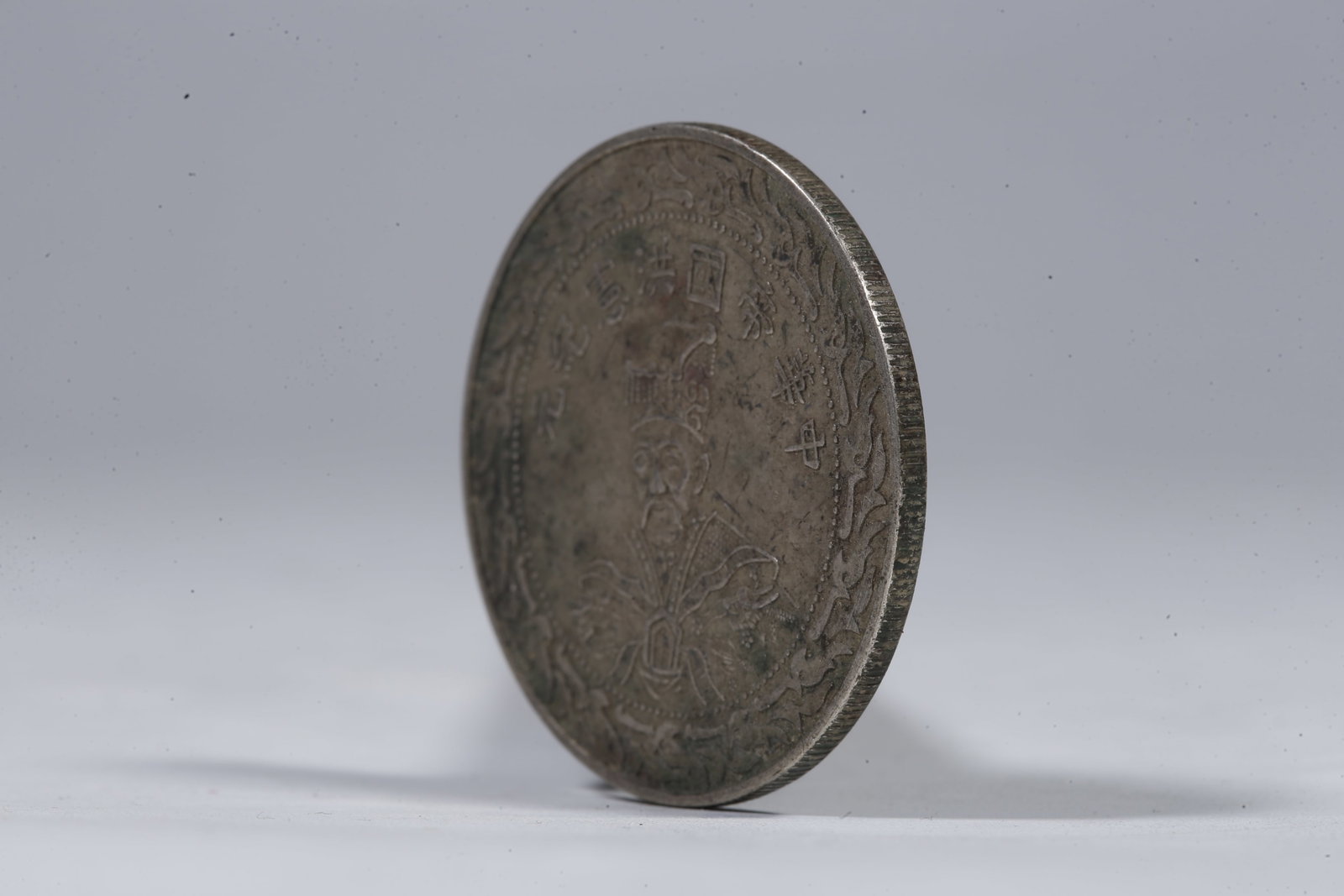 A SILVER DOLLAR COIN - 2