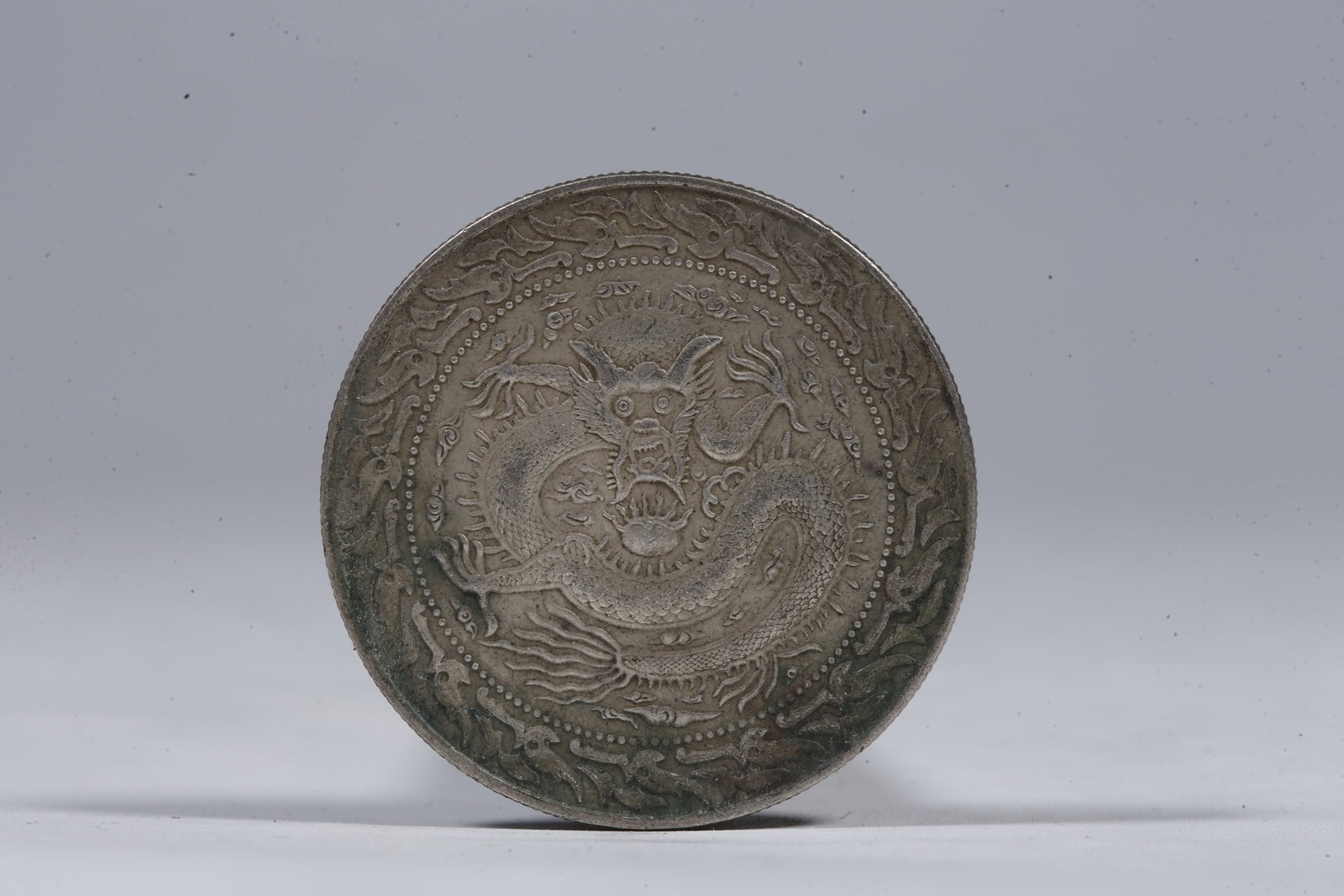 A SILVER DOLLAR COIN - 3