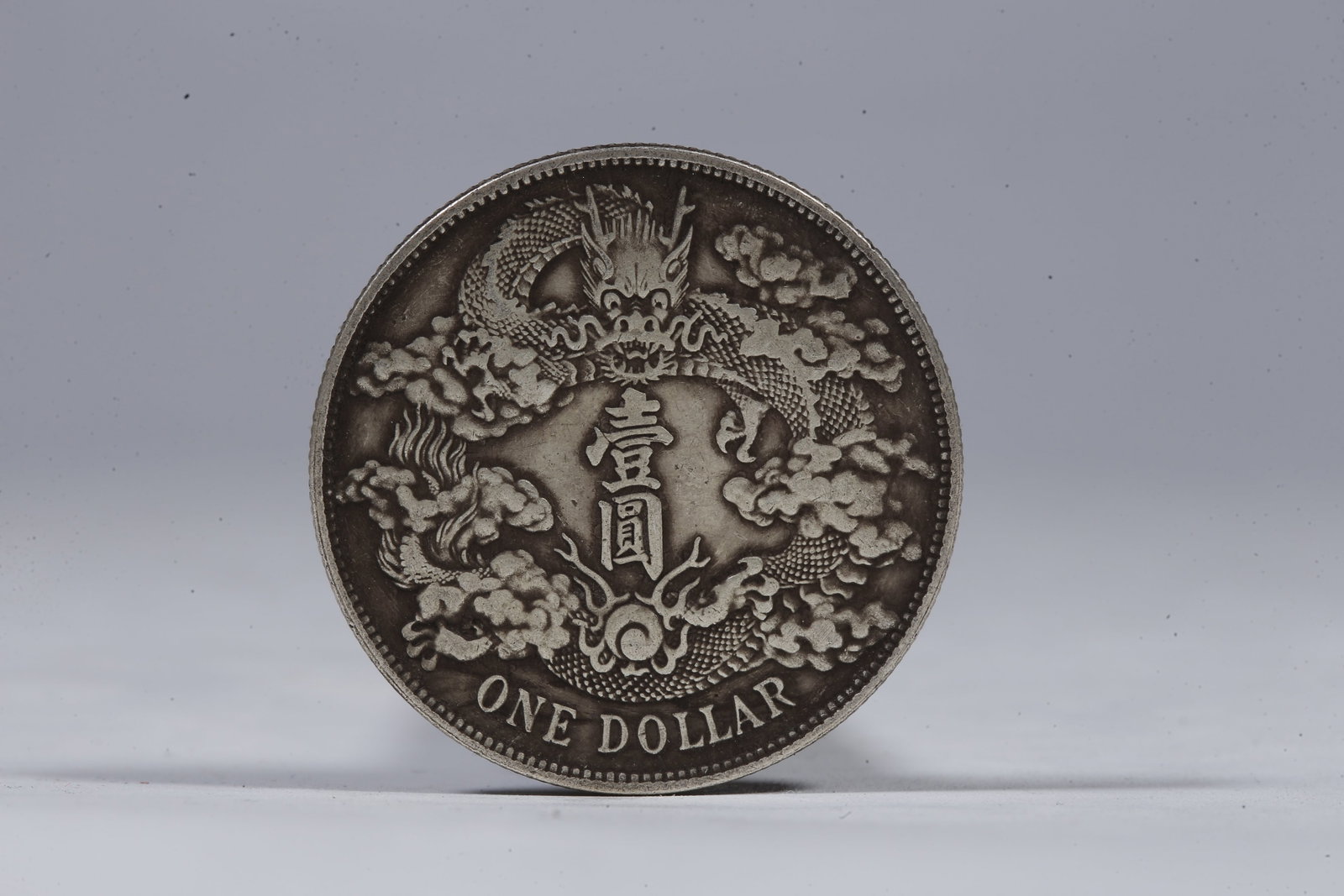 A SILVER DOLLAR COIN - 3