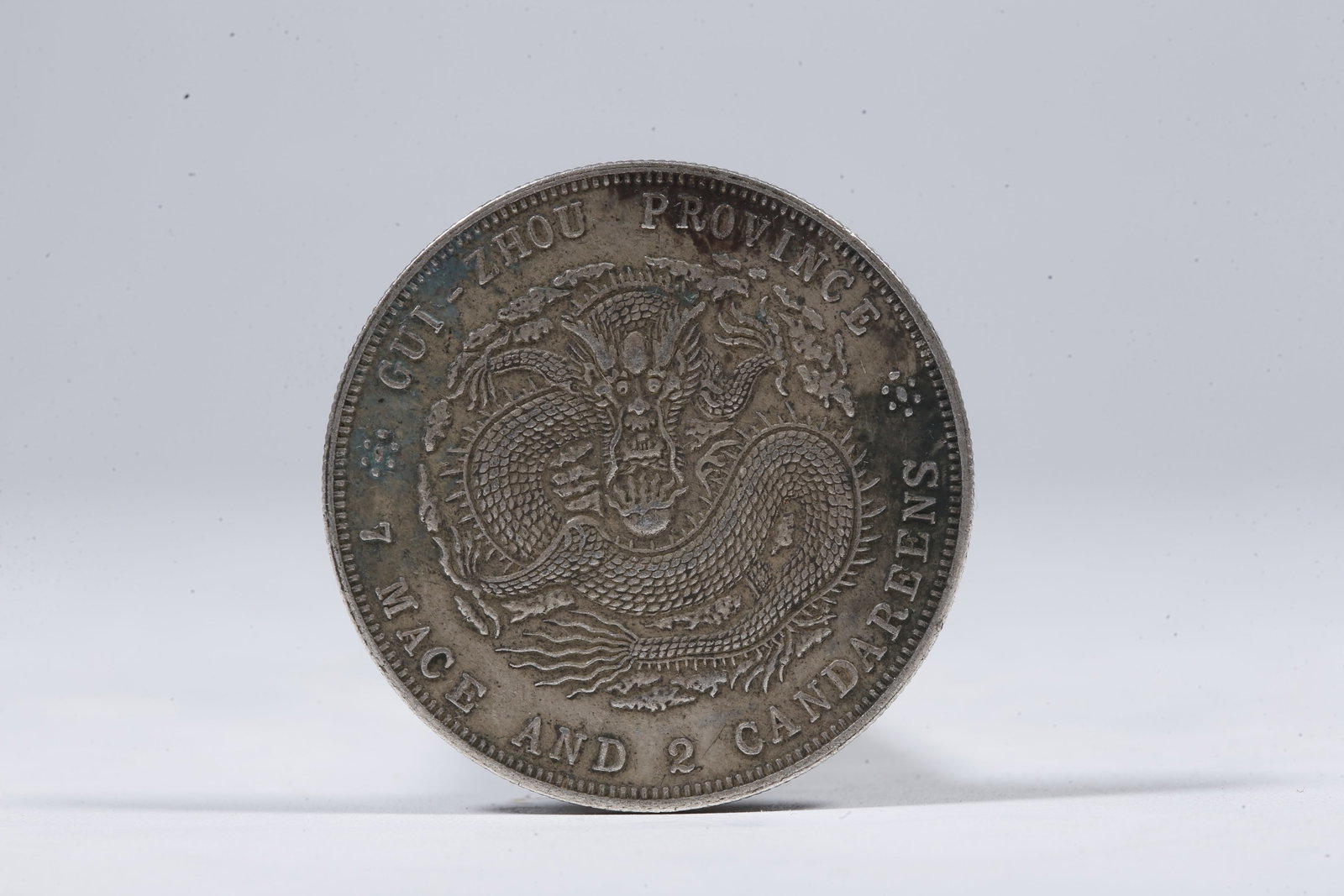A SILVER DOLLAR COIN - 3