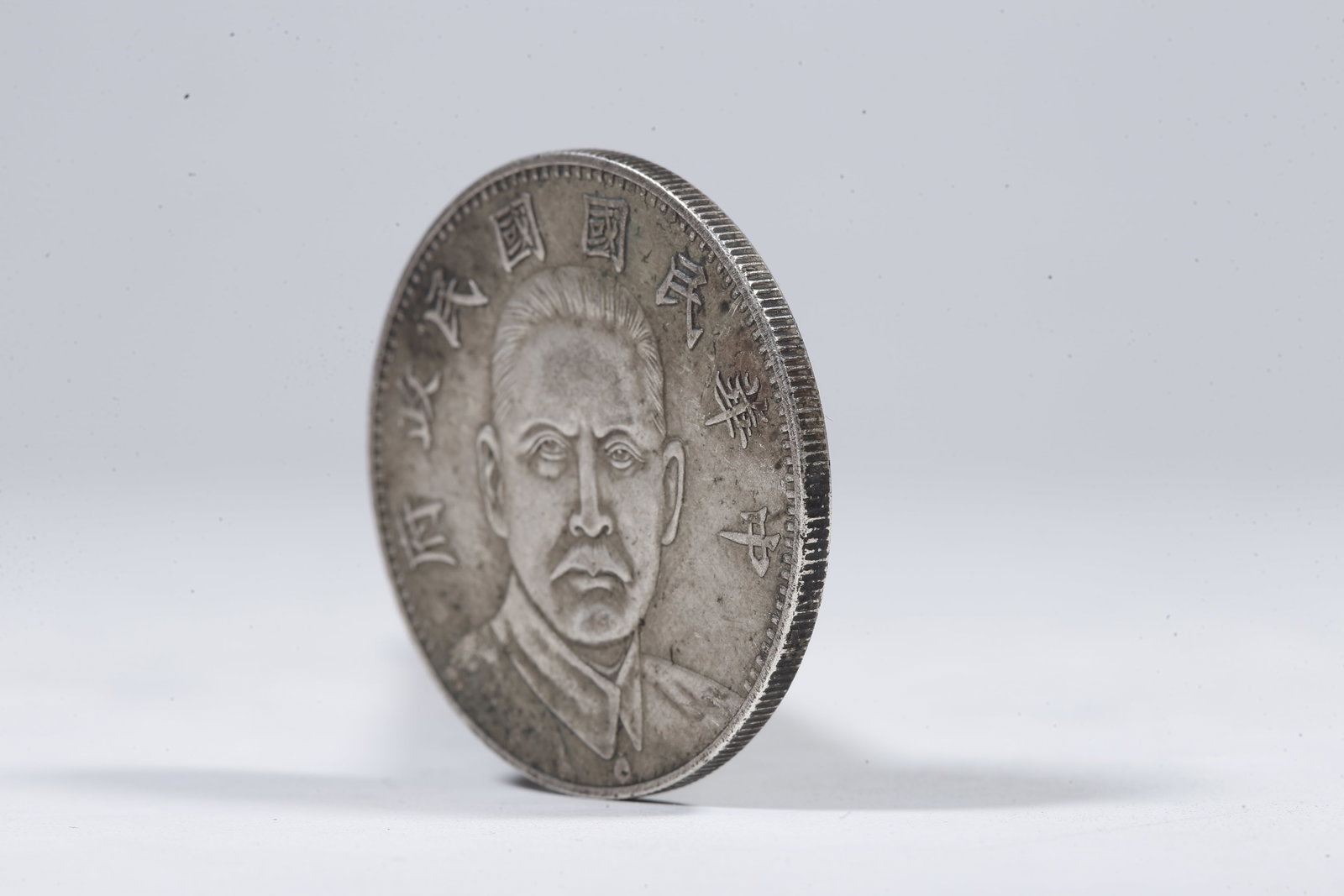 A SILVER DOLLAR COIN - 2