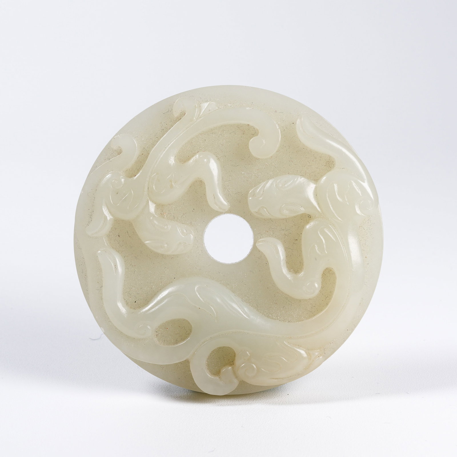 A HETIAN JADE BI DISC WITH CHILONG DRAGON PATTERN (1 of 7)