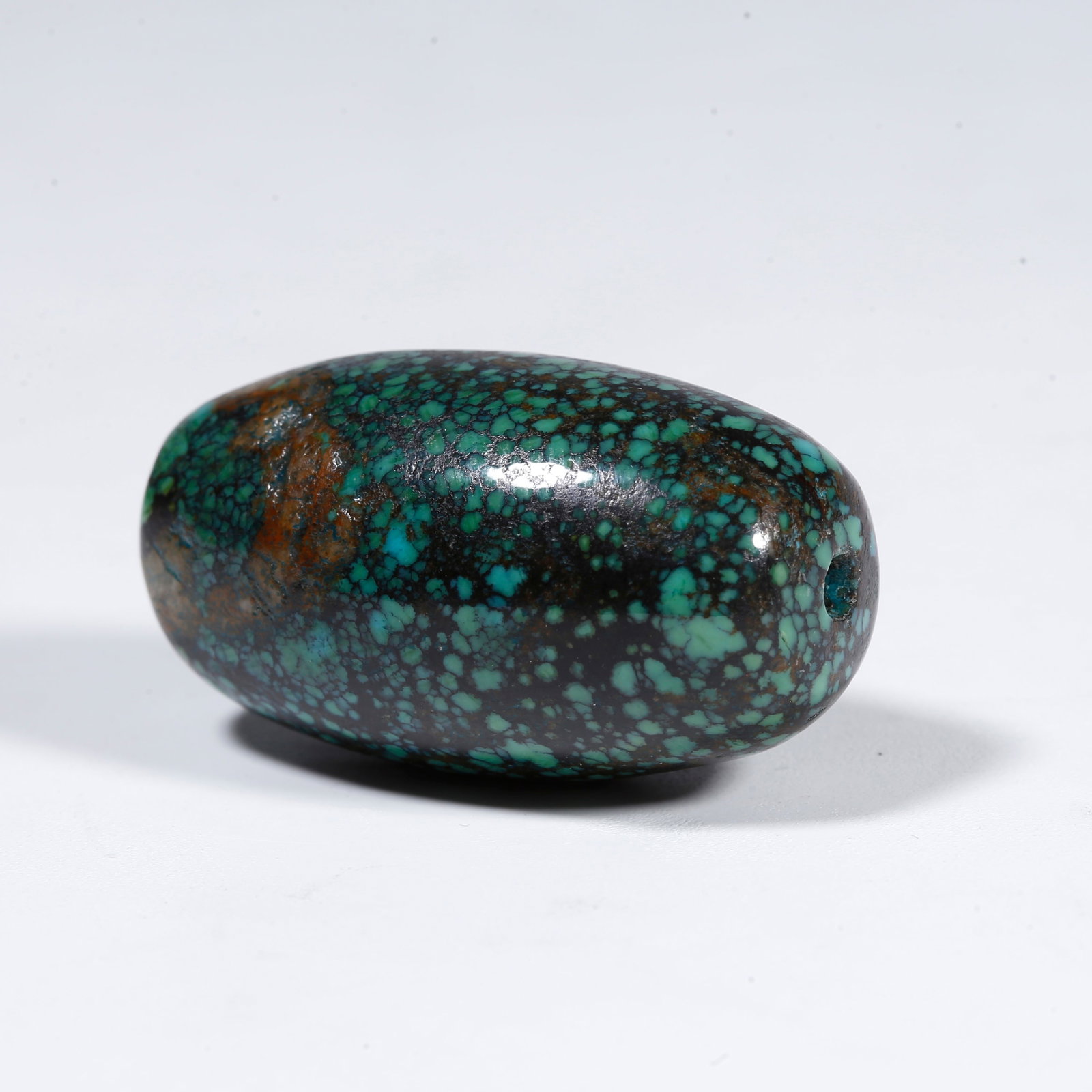 A TURQUOISE BEAD: Turquoise bead