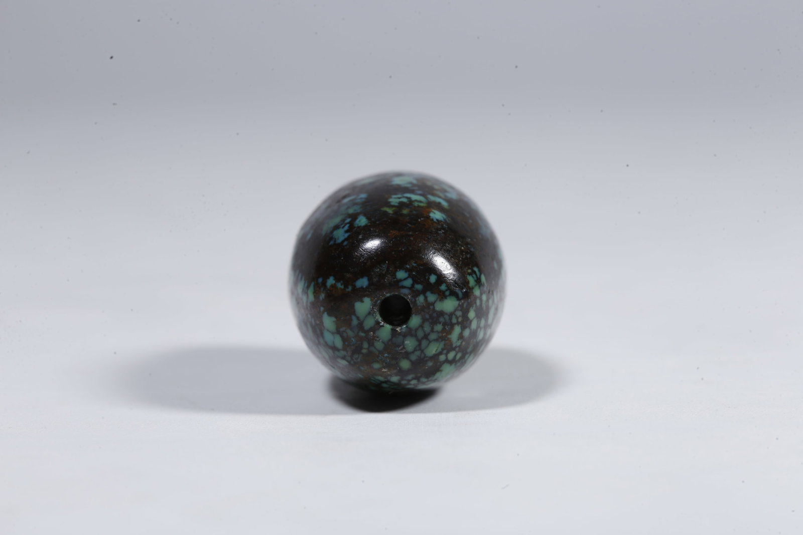 A TURQUOISE BEAD - 9