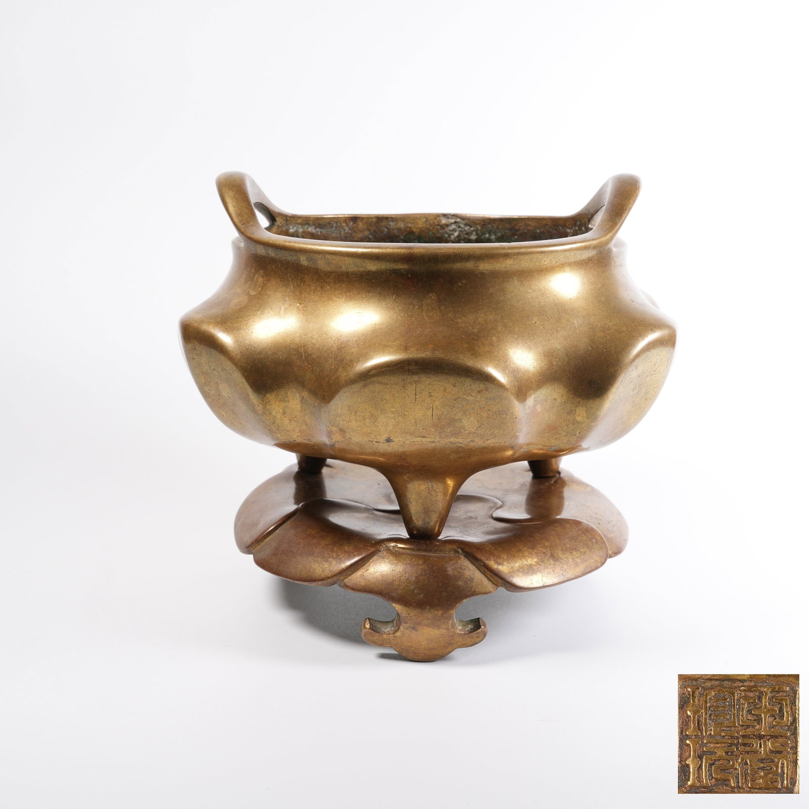 A BRONZE ORANGE-POUCH-SHAPED CENSER WITH BRIDGE-SHAPED EARS AND STAND: Bronze Orange-pouch-shaped Censer with Bridge-shaped Ears and Stand