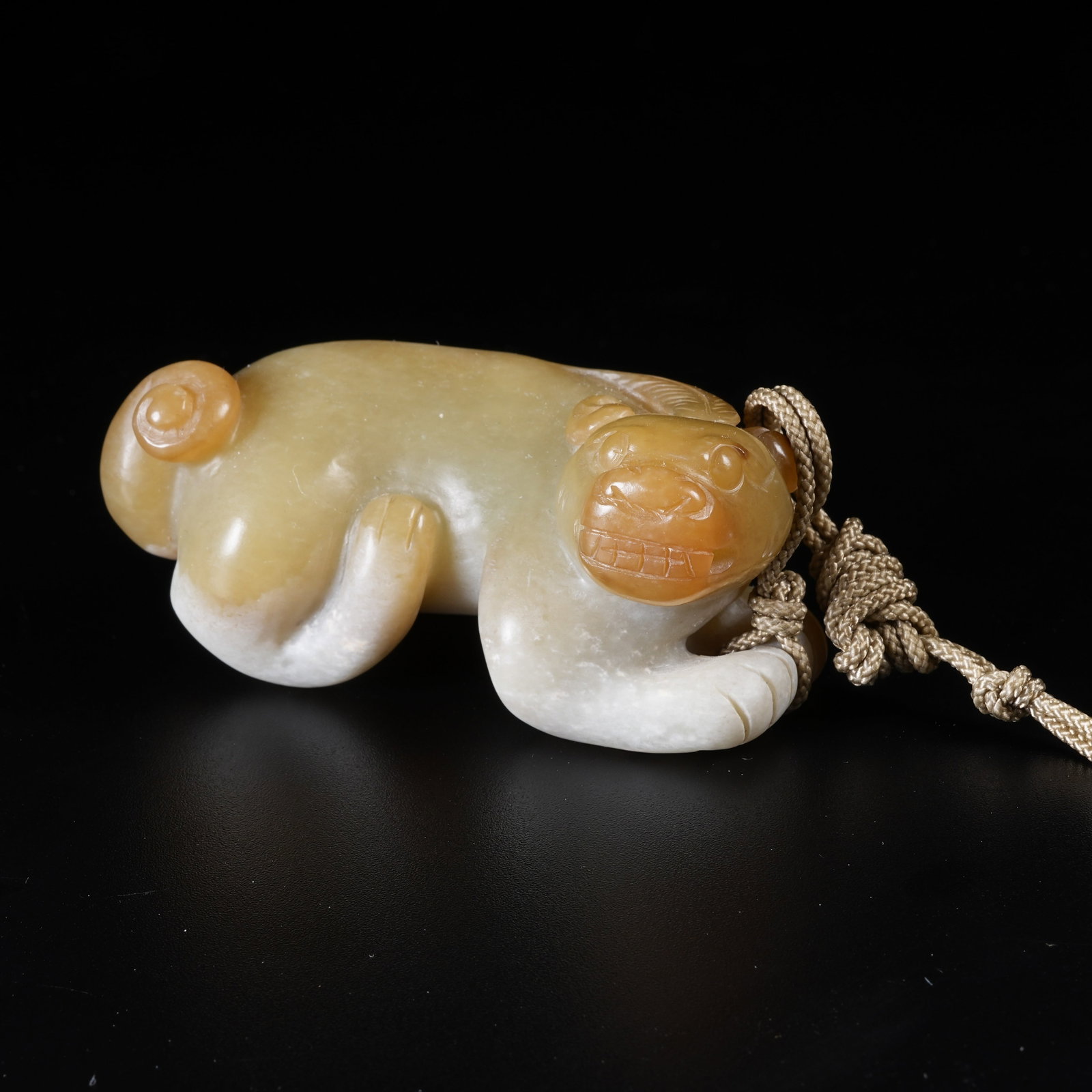 A ANCIENT JADE AUSPICIOUS BEAST PENDANT: Ancient Jade Auspicious Beast Pendant