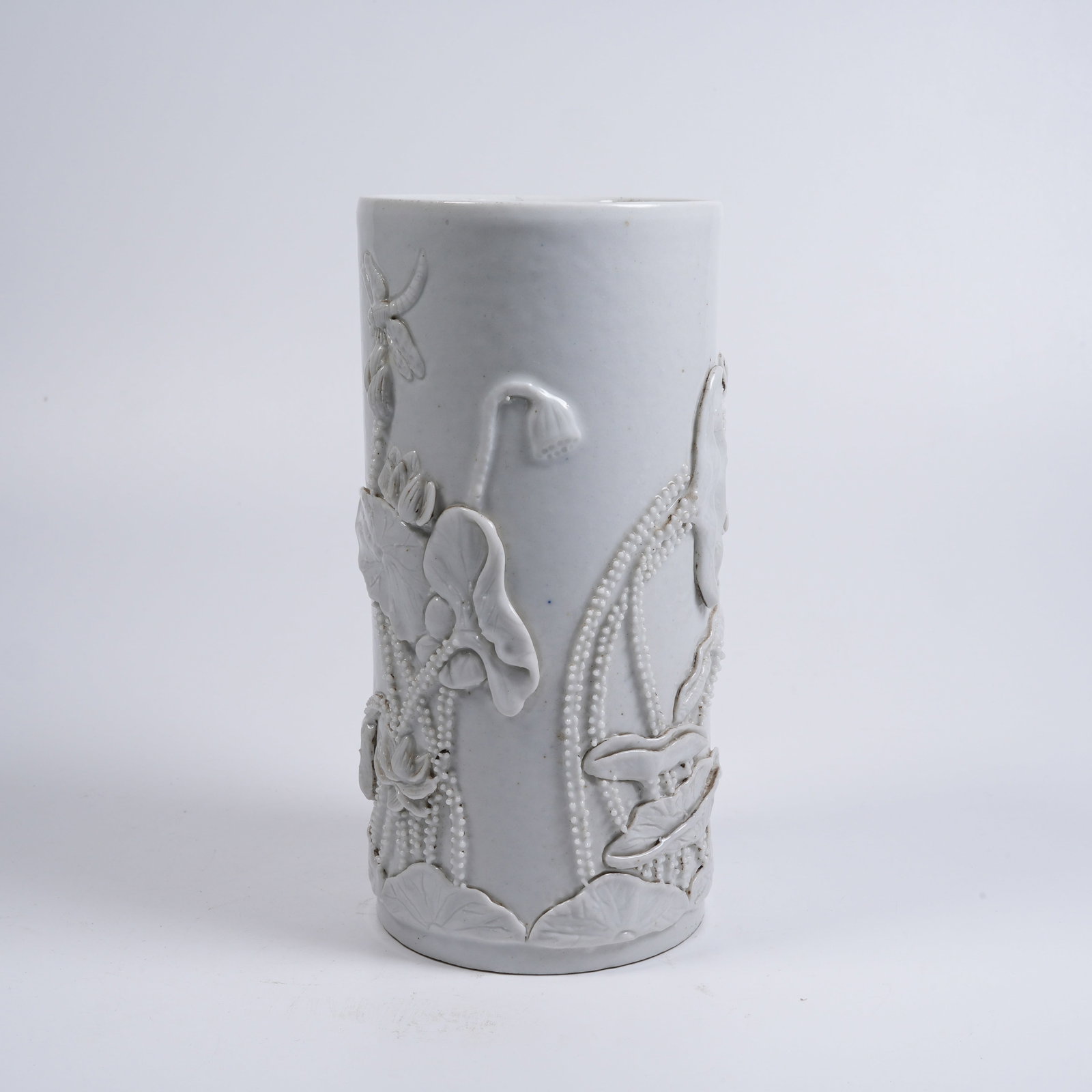 A CARVED-PORCELAIN WRITING-BRUSH POT WITH LOTUS-FLOWER PATTERN (1 of 9)