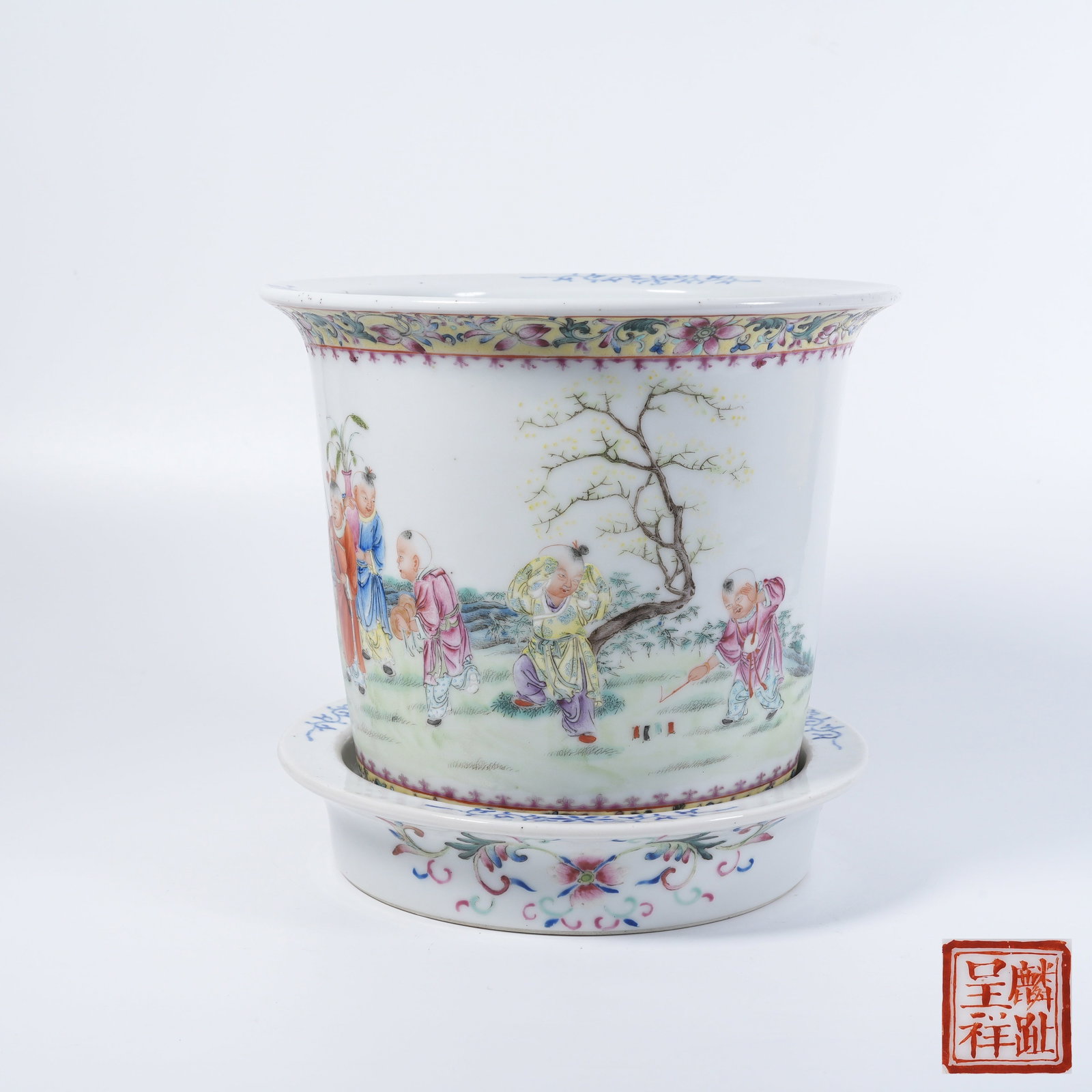 A FAMILLE-ROSE FLOWER POT WITH CHILDREN-AT-PLAY SCENE: Famille-rose flower pot with children-at-play scene