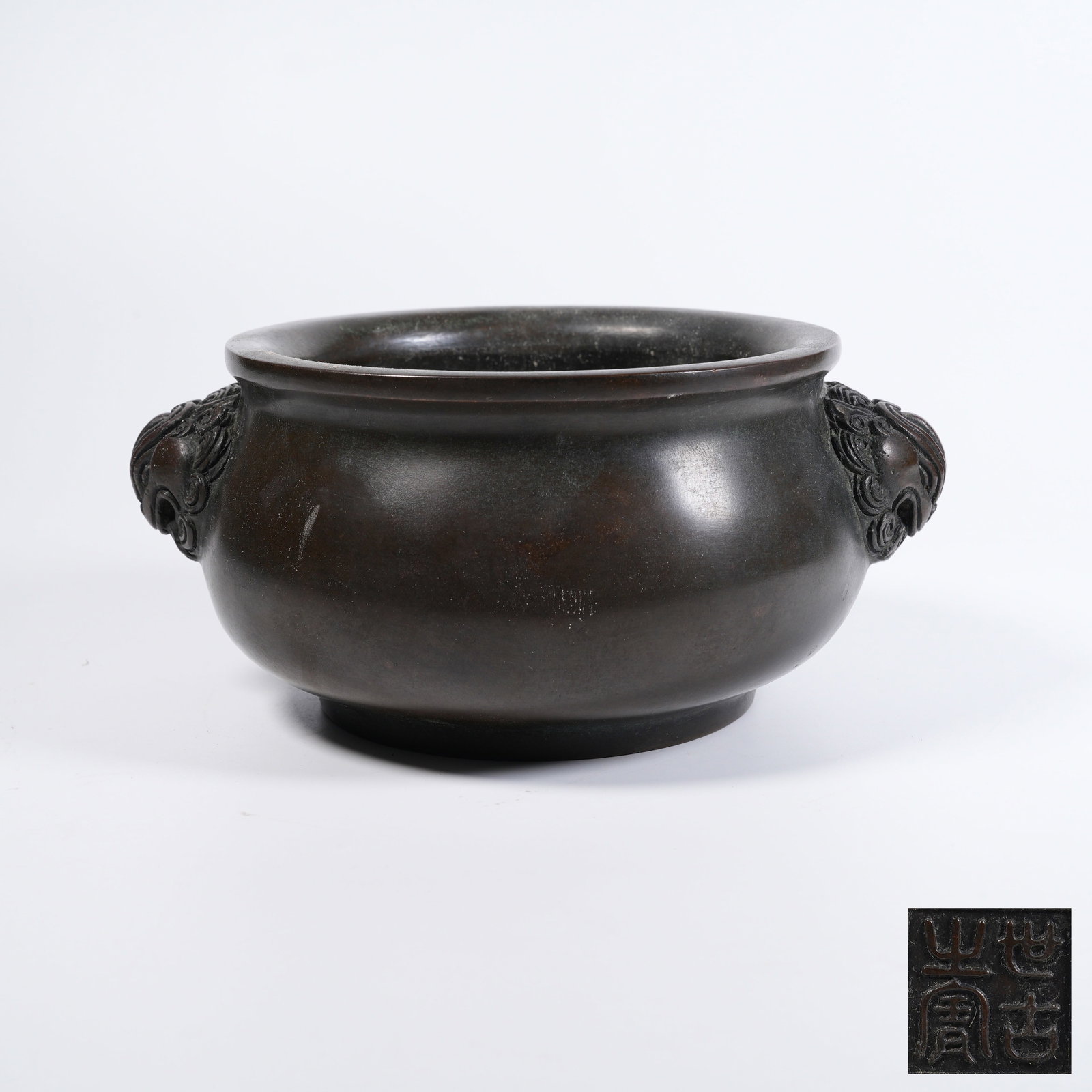 A COPPER CENSER WITH LION-SHAPED EARS: Copper censer with lion-shaped ears