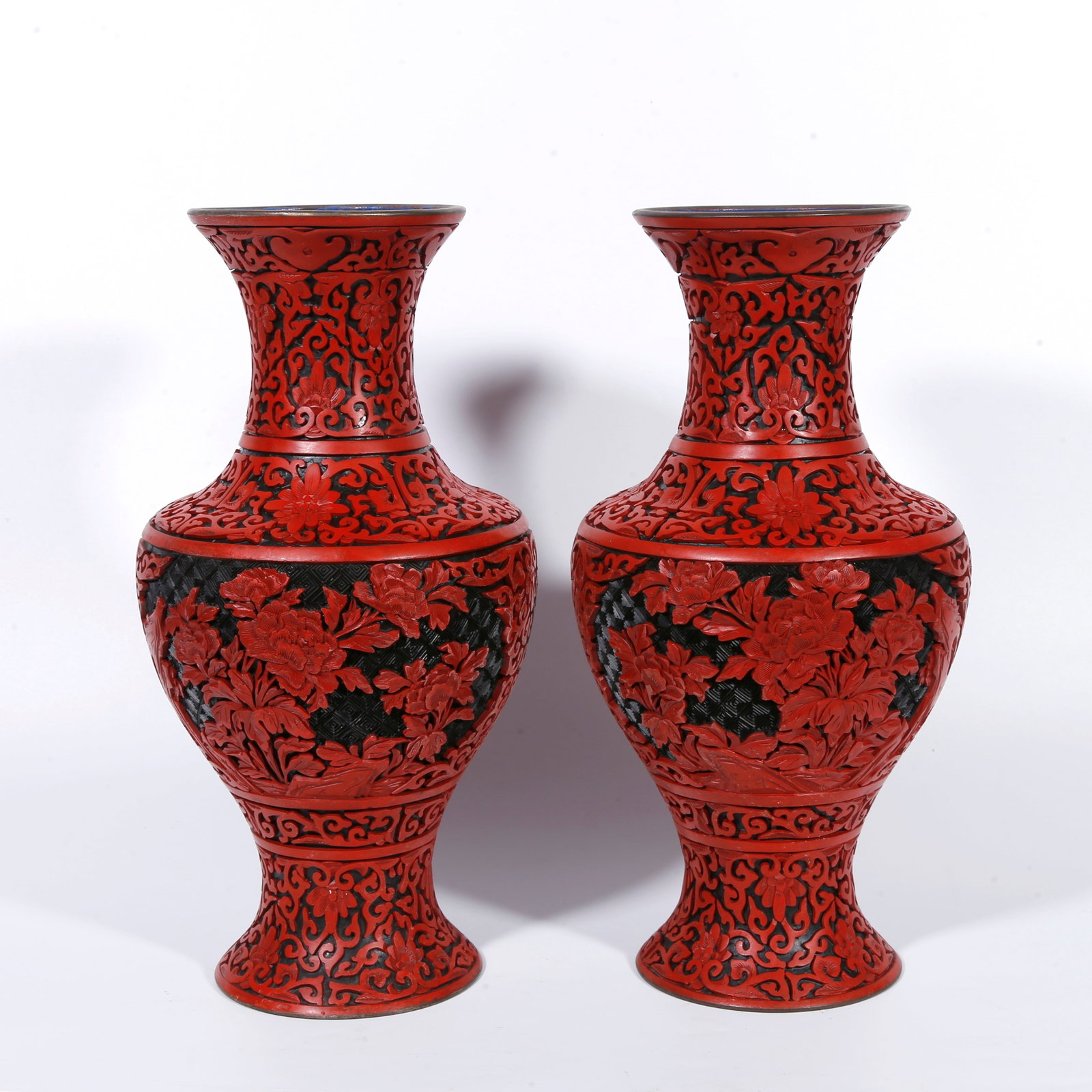 A BRONZE-BODY CARVED-RED VASE WITH ROCK-AND-FLOWER PATTERN (PAIR): Bronze-body carved-red vase with rock-and-flower pattern (pair)