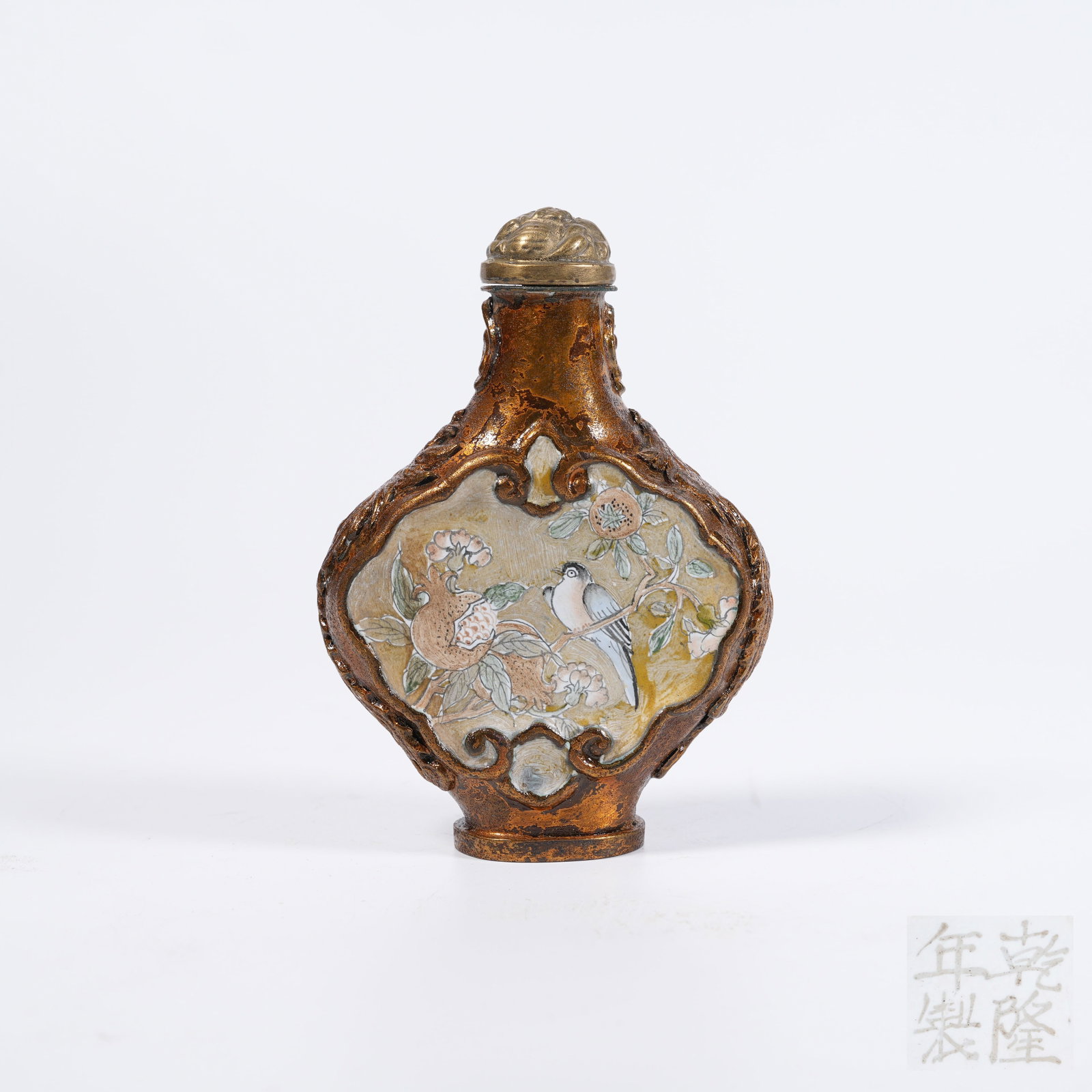 A COPPER-BODY SNUFF BOTTLE WITH FLOWER-AND-BIRD PATTERN: Copper-body snuff bottle with flower-and-bird pattern