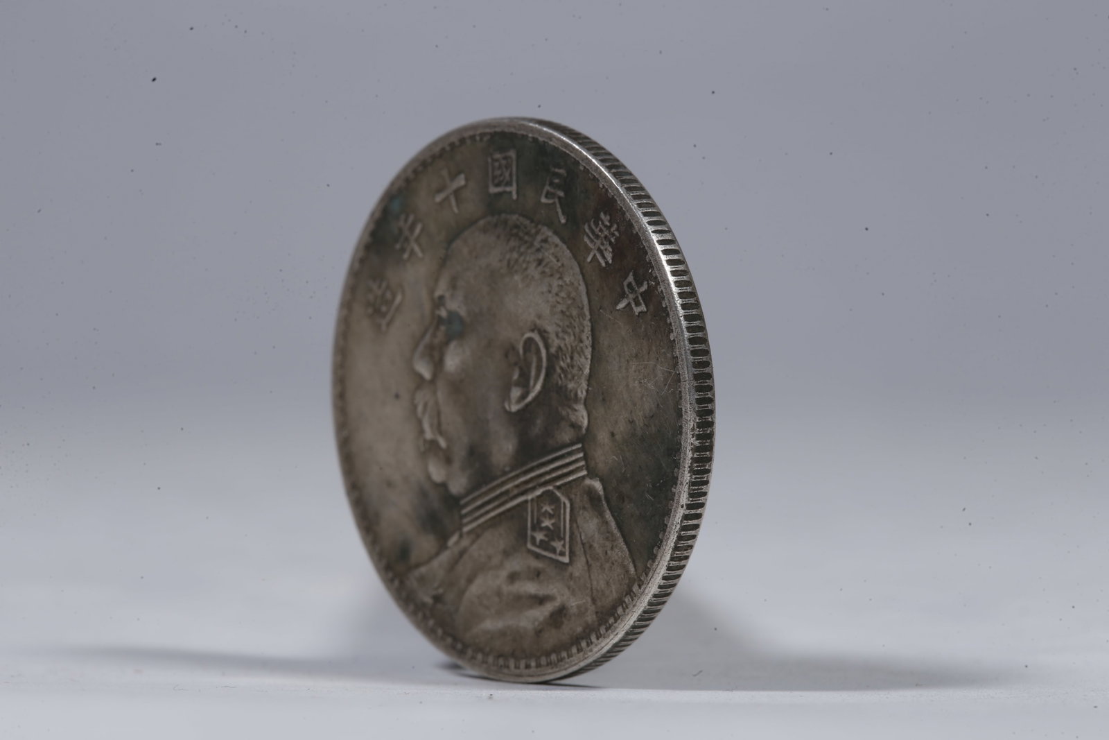 A SILVER DOLLAR COIN - 2