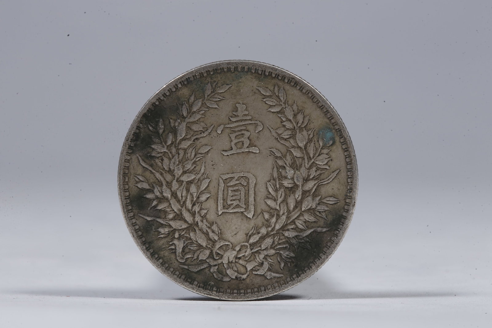 A SILVER DOLLAR COIN - 3