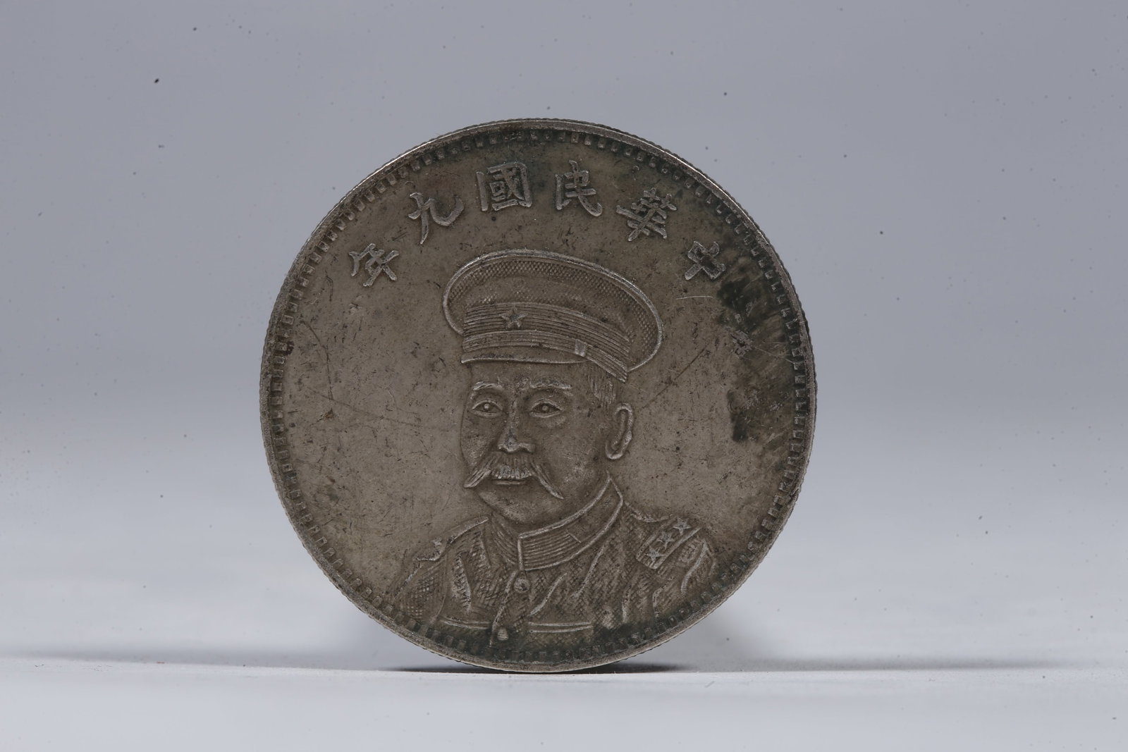 A SILVER DOLLAR COIN - 3