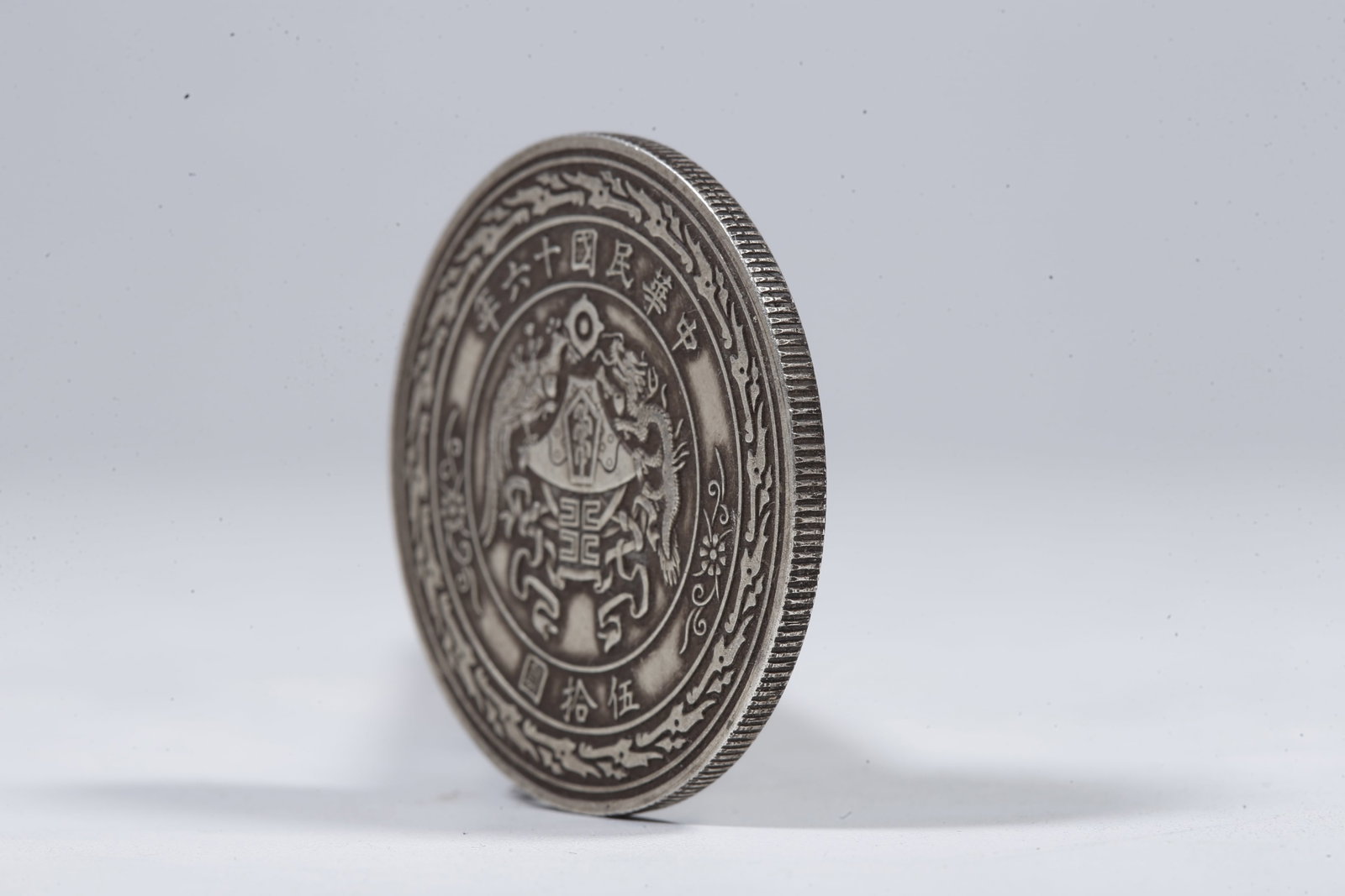 A SILVER DOLLAR COIN - 2