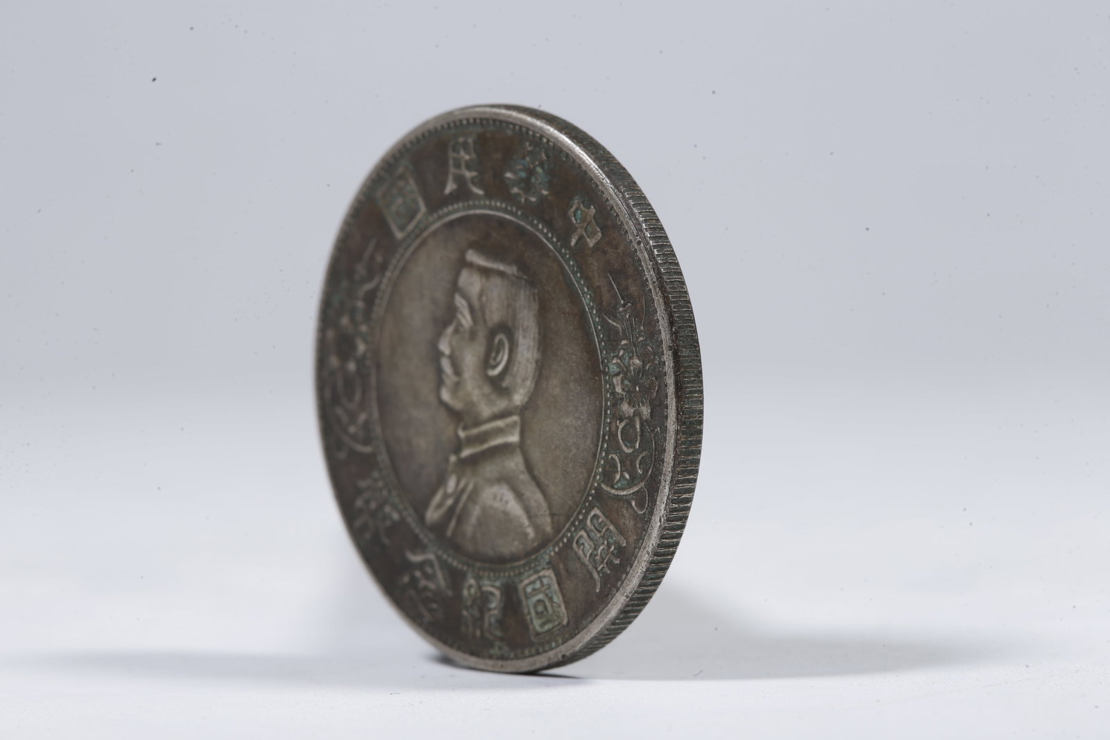 A SILVER DOLLAR COIN - 2