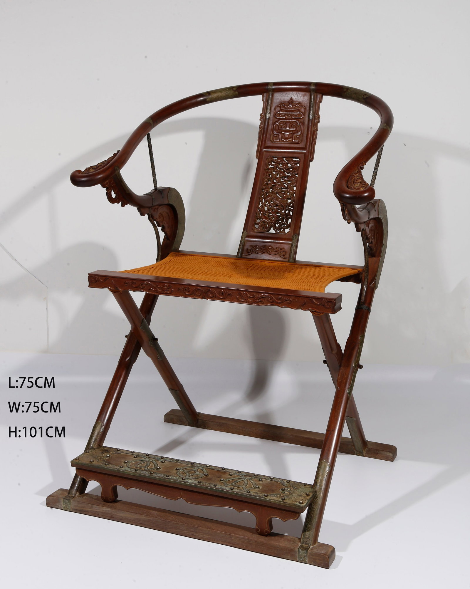 A FOLDING ARMCHAIR OF HUANGHUALI WOOD: Folding armchair of huanghuali wood